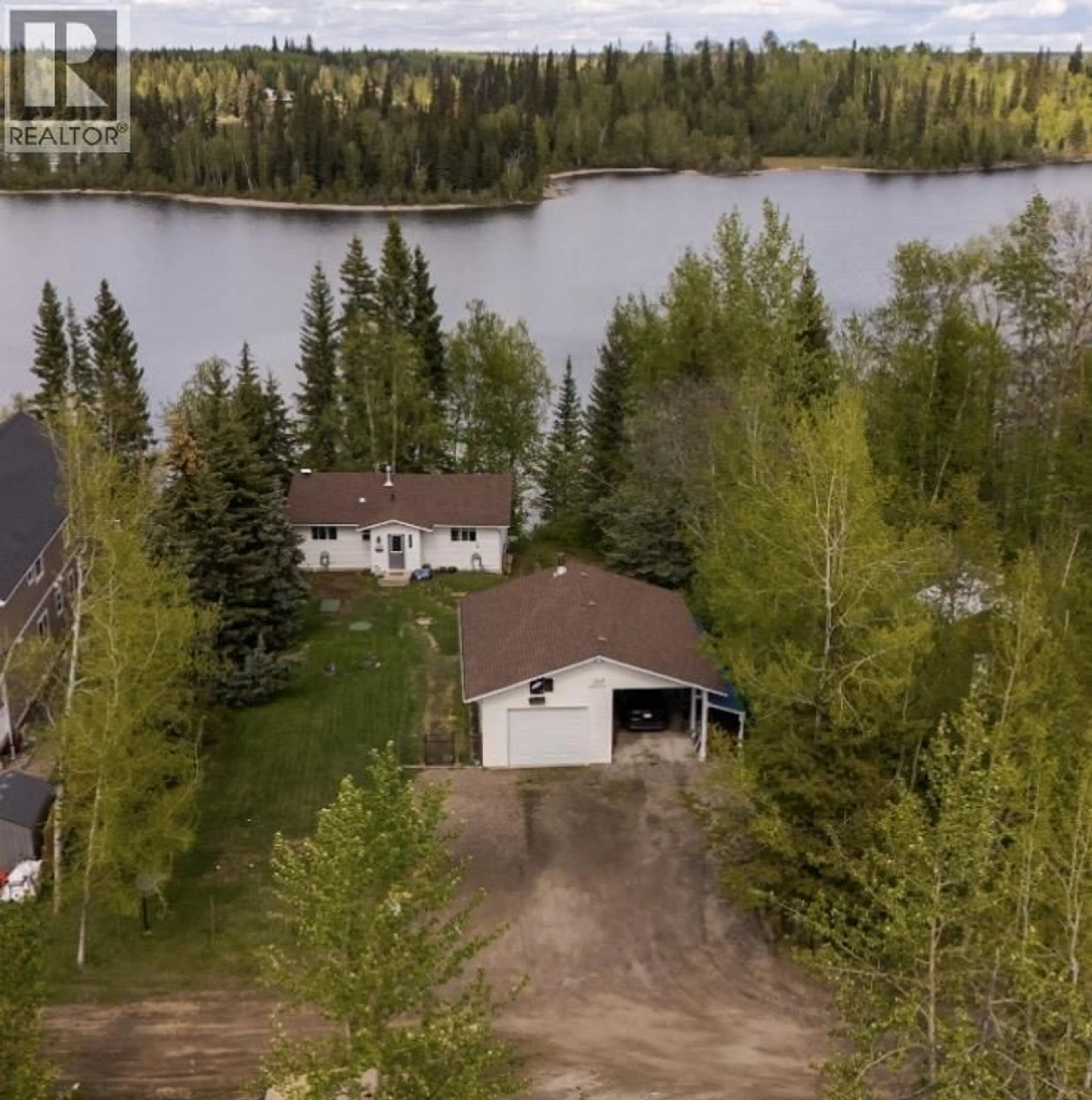 A pic from outside/outdoor area/front of a property/back of a property/a pic from drone, water/lake/river/ocean view for 28220 NESS LAKE ROAD, Prince George British Columbia V2K5N1