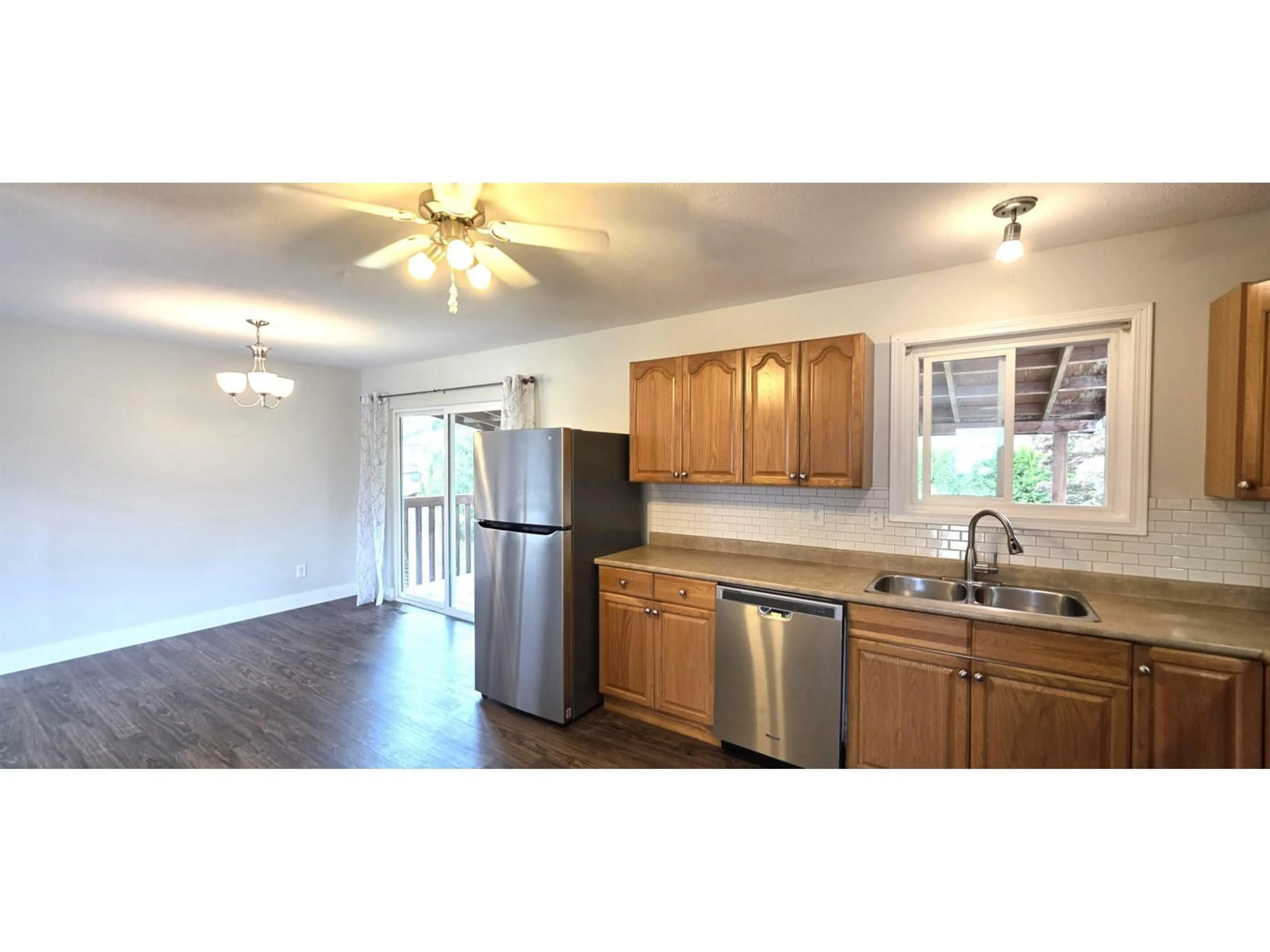 Open concept kitchen, wood/laminate floor for 5635 TYSON ROAD, Chilliwack British Columbia V2R2K6