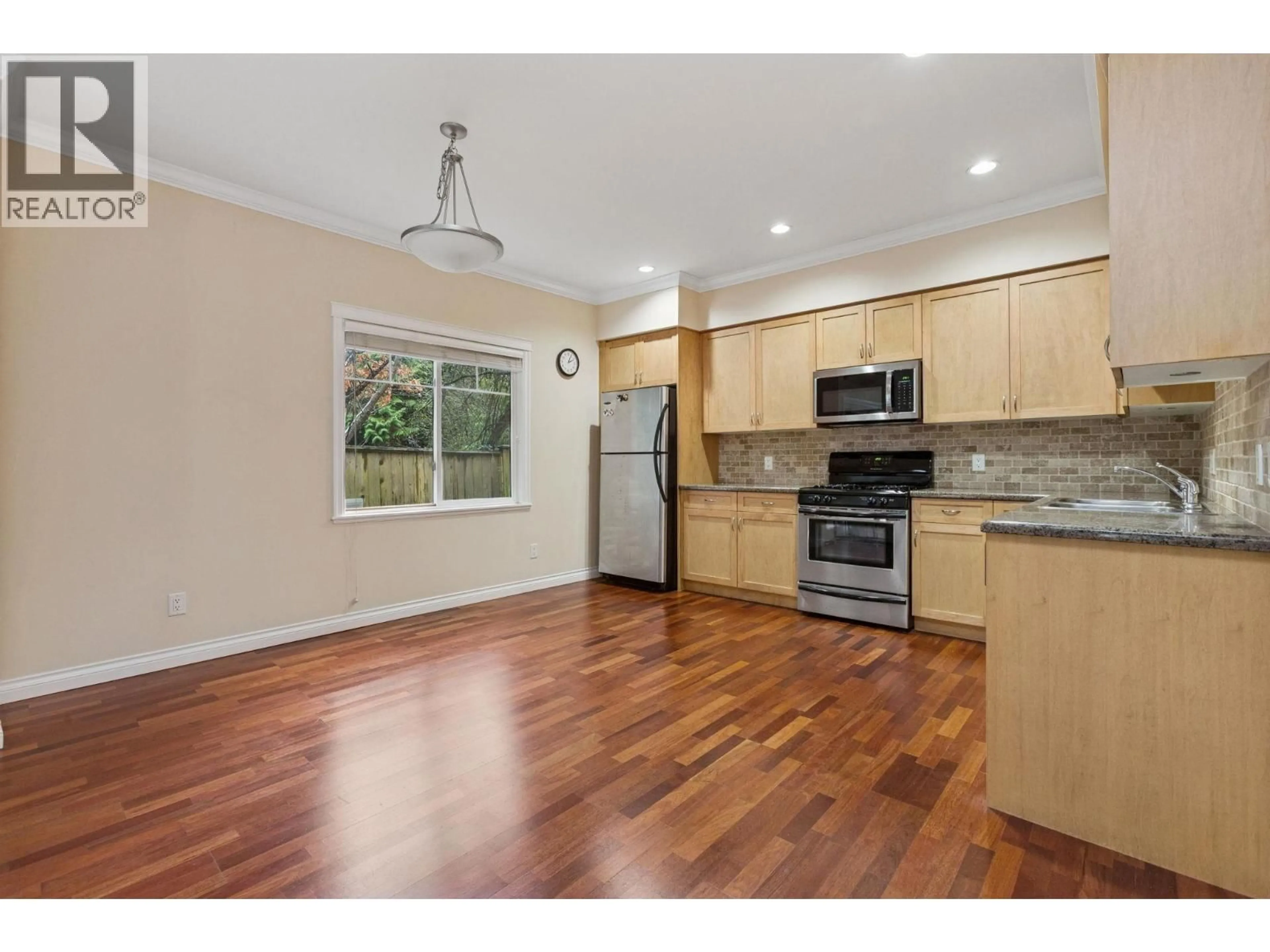 Open concept kitchen, wood/laminate floor for 19 - 7331 NO. 4 ROAD, Richmond British Columbia V6Y2T4