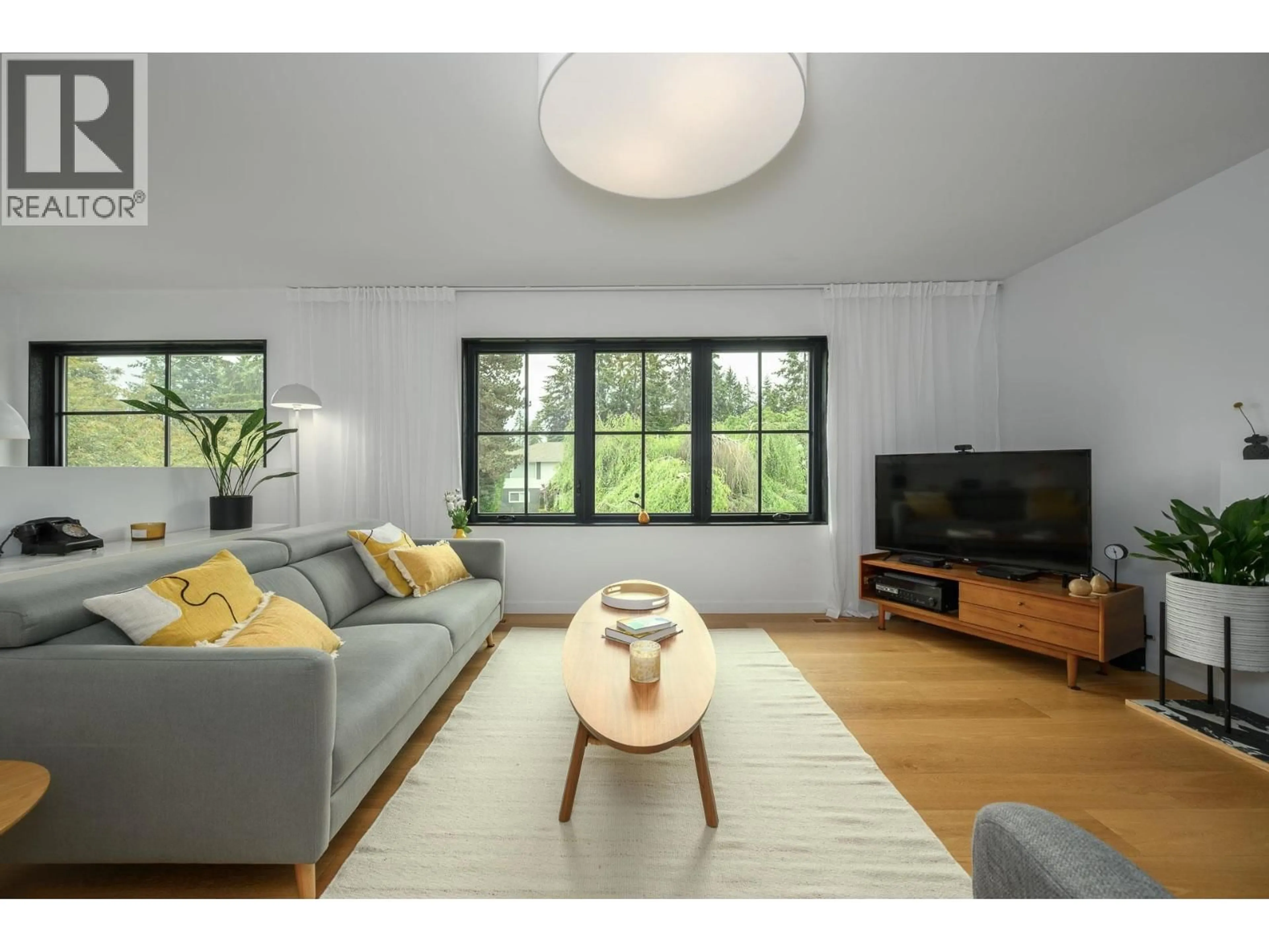 Living room with furniture, wood/laminate floor for 5471 7B AVENUE, Delta British Columbia V4M1S7