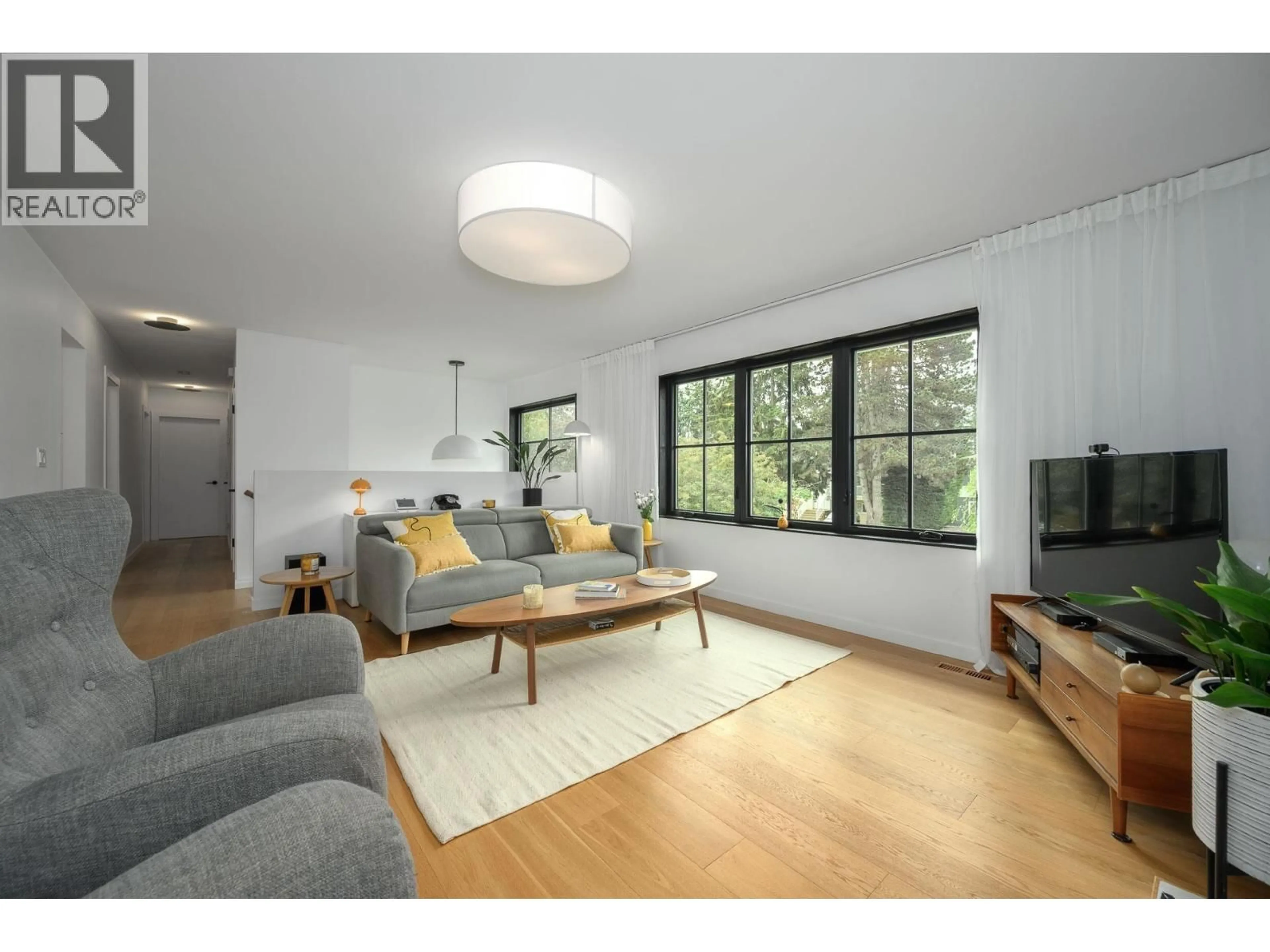 Living room with furniture, wood/laminate floor for 5471 7B AVENUE, Delta British Columbia V4M1S7