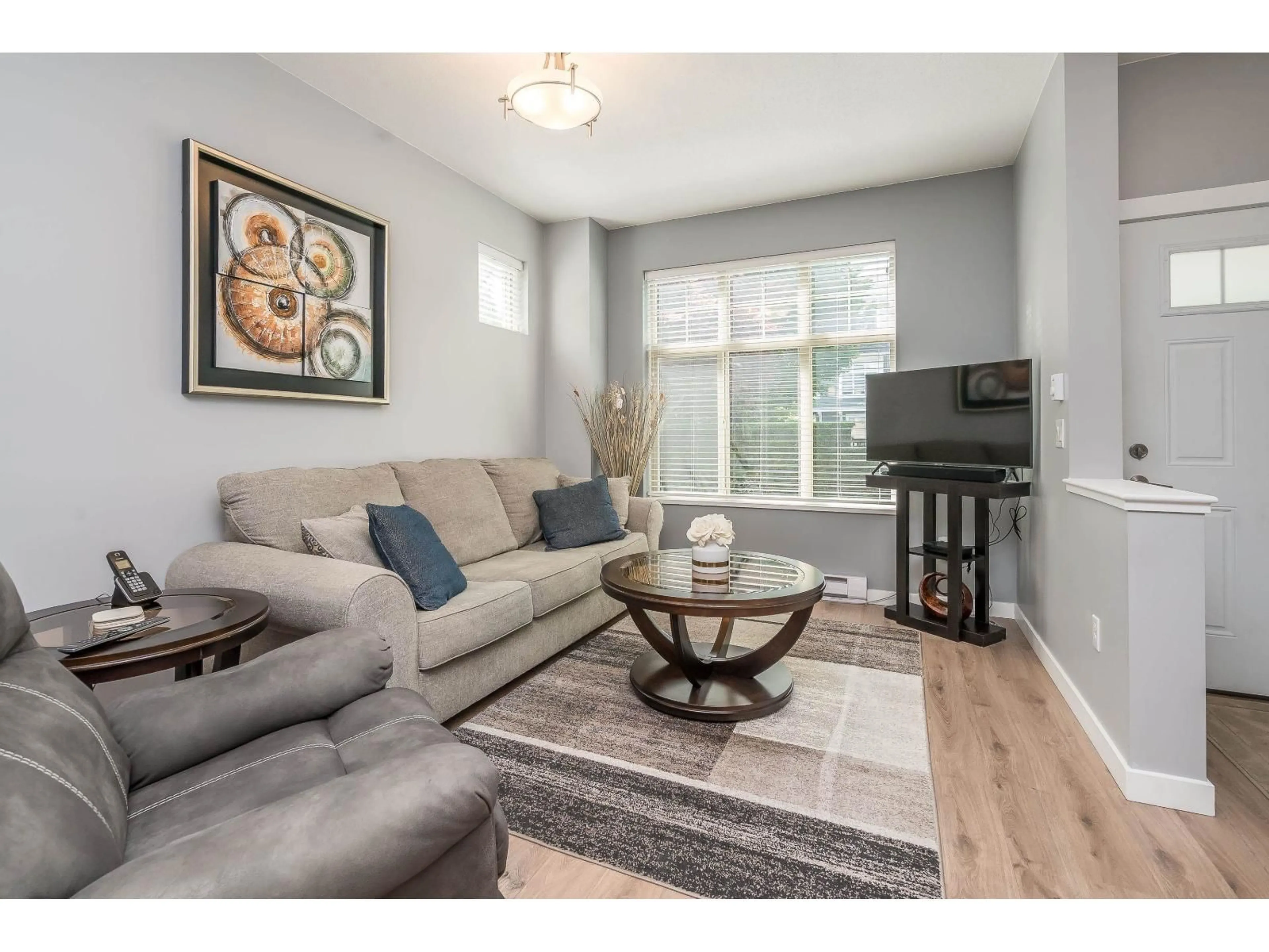 Living room with furniture, wood/laminate floor for 61 - 31125 WESTRIDGE PLACE, Abbotsford British Columbia V2T0B9