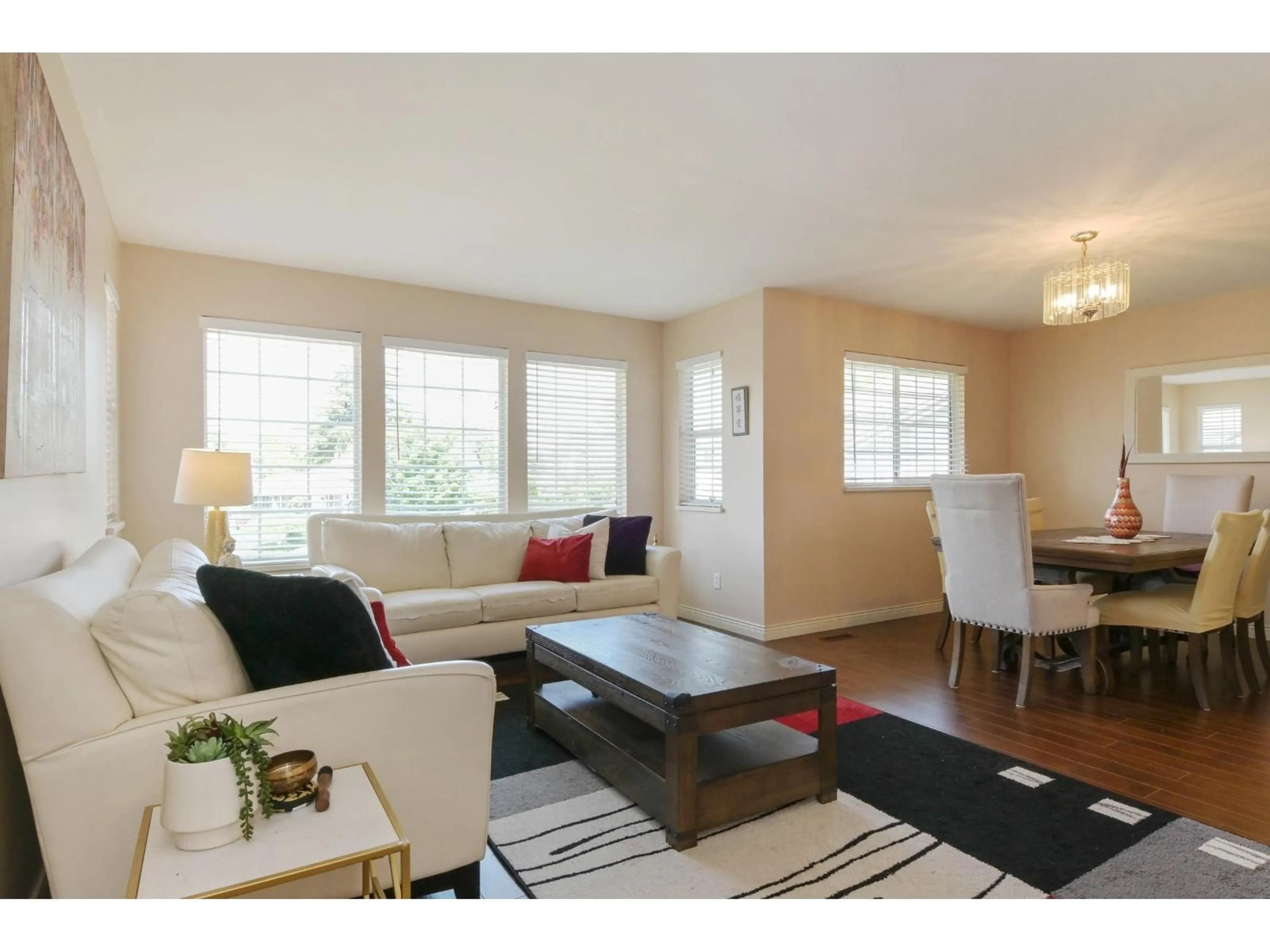 Living room with furniture, wood/laminate floor for 6084 185 STREET, Surrey British Columbia V3S7P7
