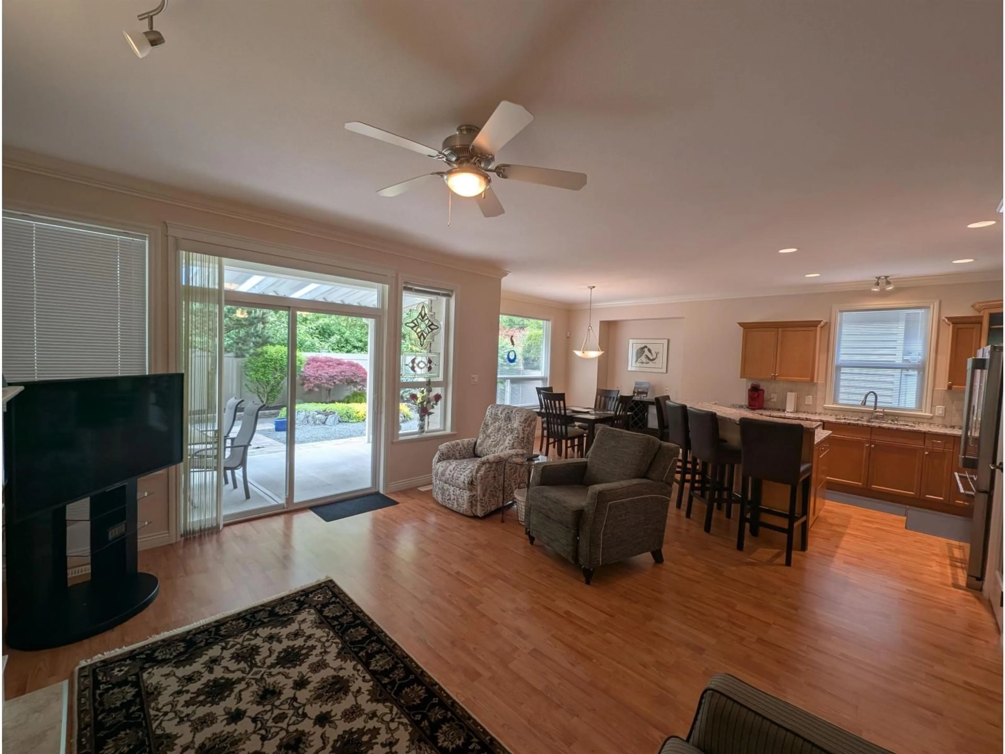 Living room with furniture, wood/laminate floor for 46570 HEARTHSTONE AVENUE, Chilliwack British Columbia V2R0E4