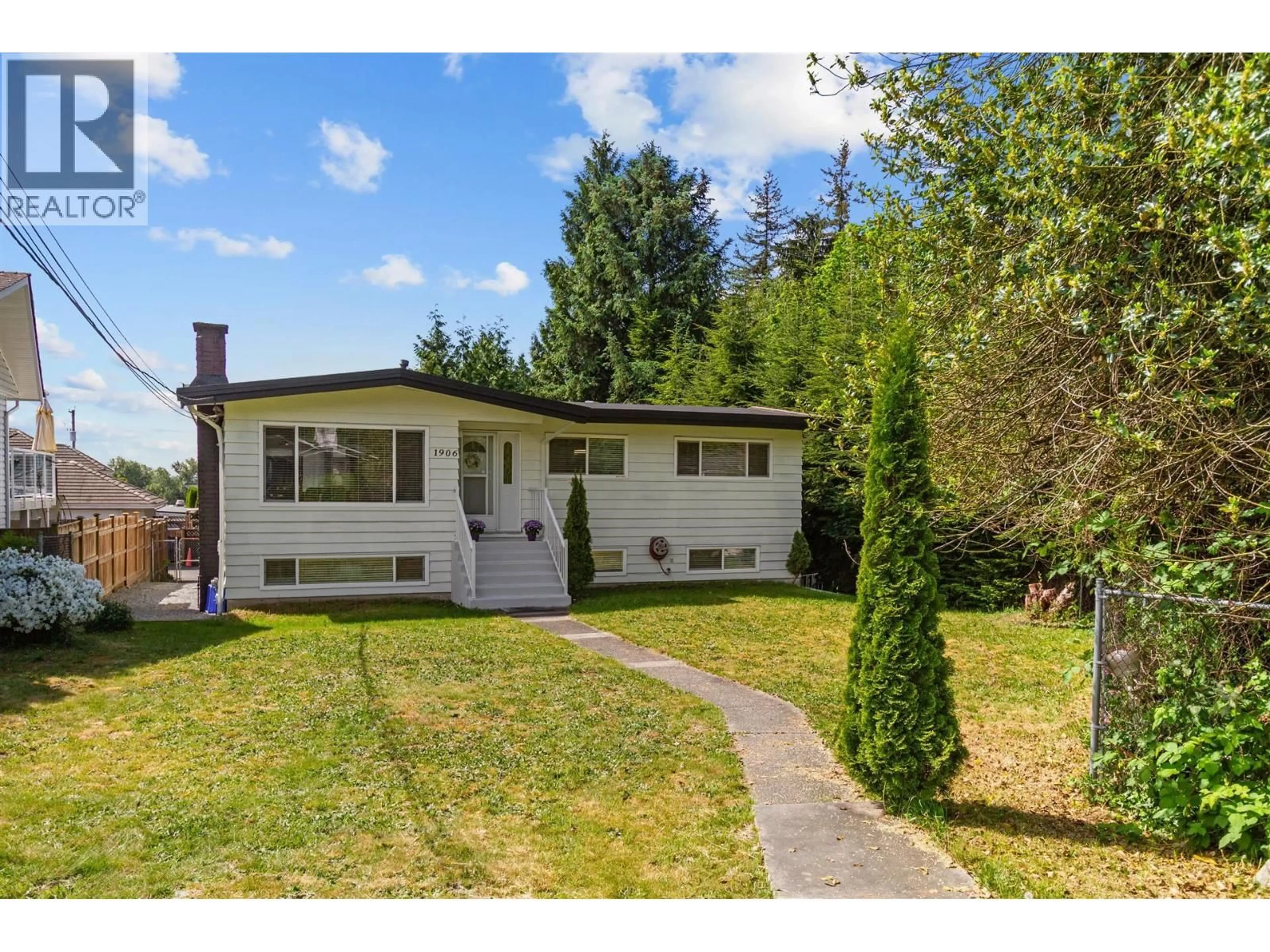 Home with vinyl exterior material, street for 1906 RHODENA AVENUE, Coquitlam British Columbia V3K2Z9
