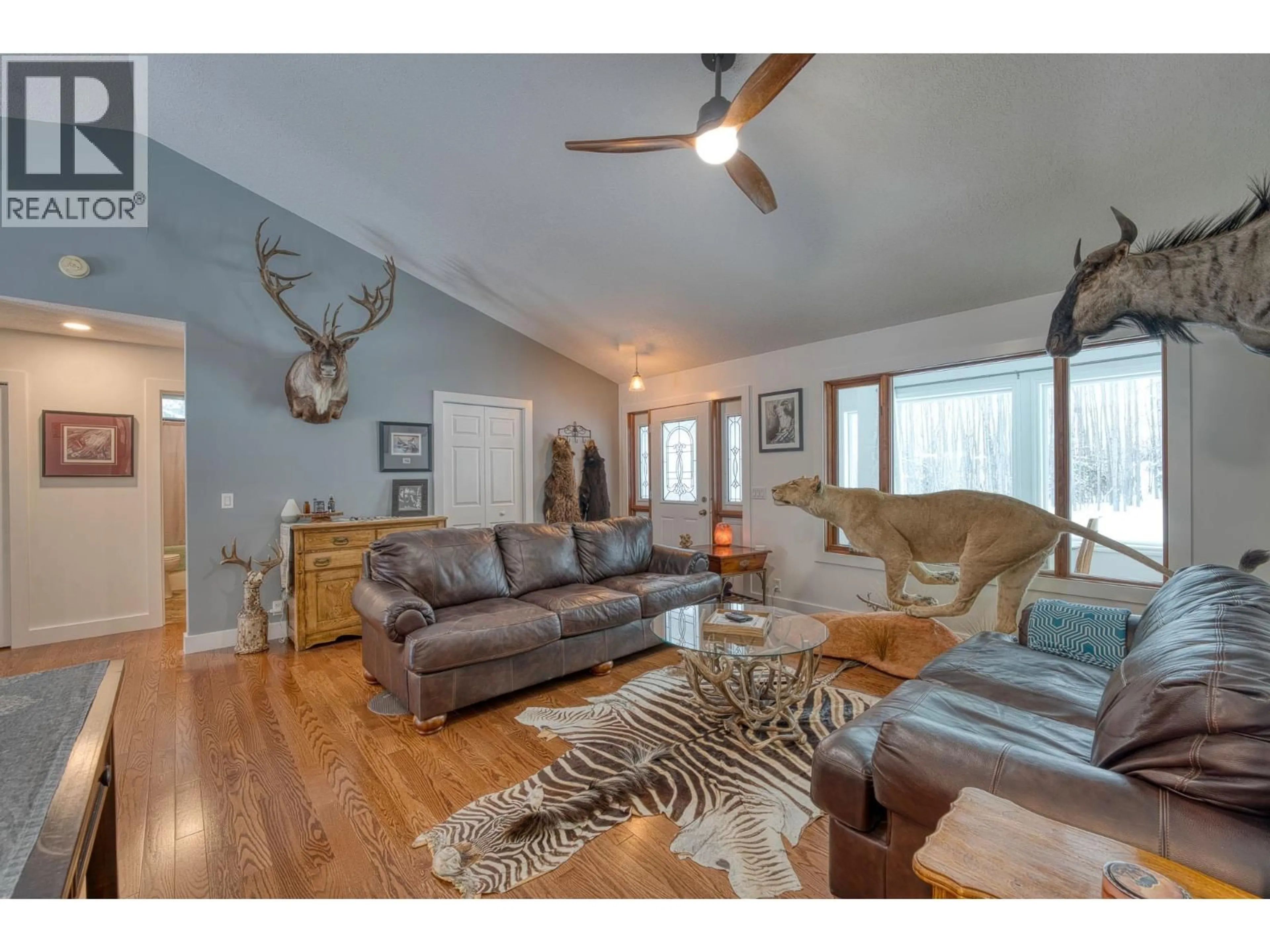 Living room with furniture, wood/laminate floor for 13244 KOOP ROAD, Fort St. John British Columbia V1J8K7