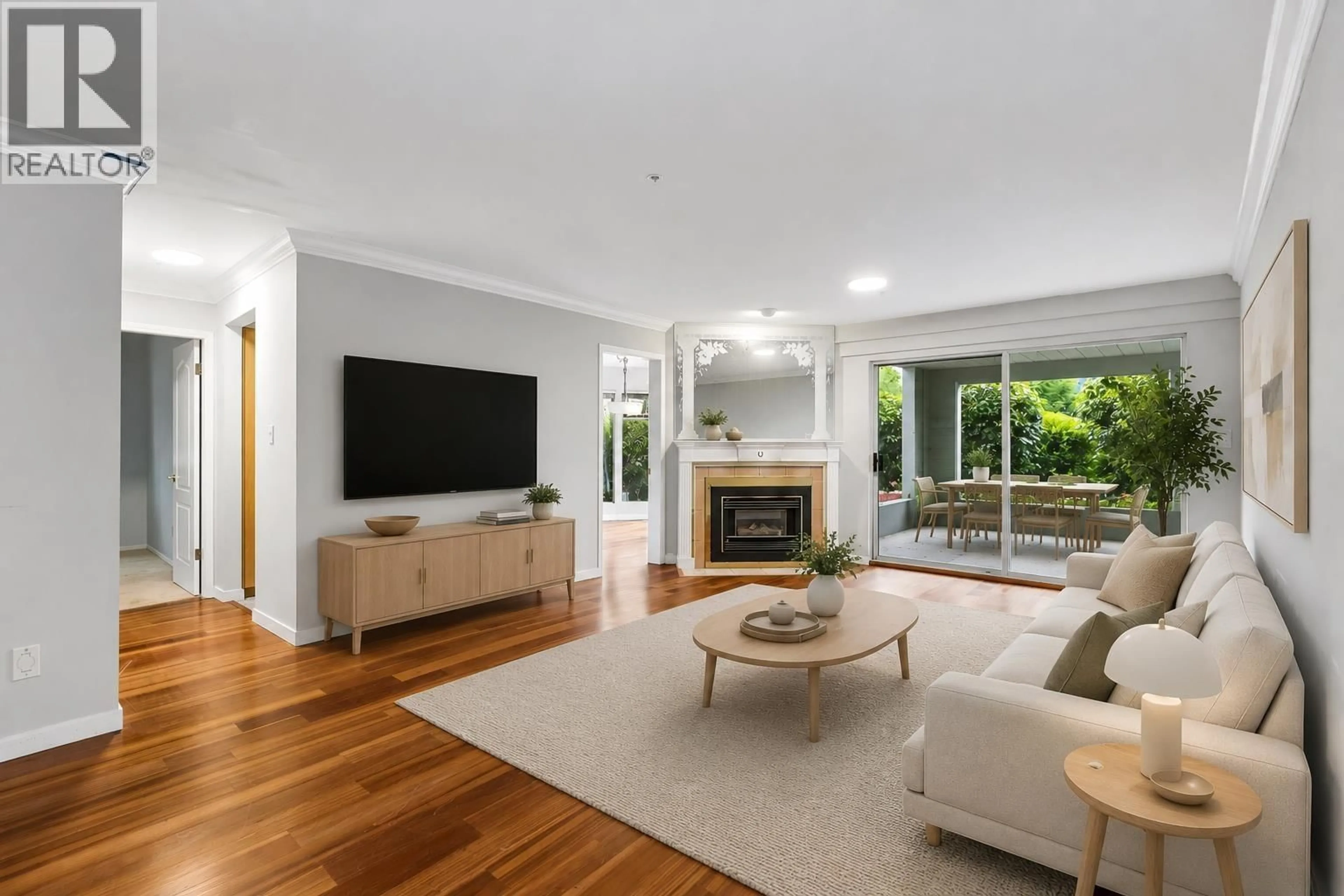 Living room with furniture, wood/laminate floor for 103 - 7580 COLUMBIA STREET, Vancouver British Columbia V5X4S8