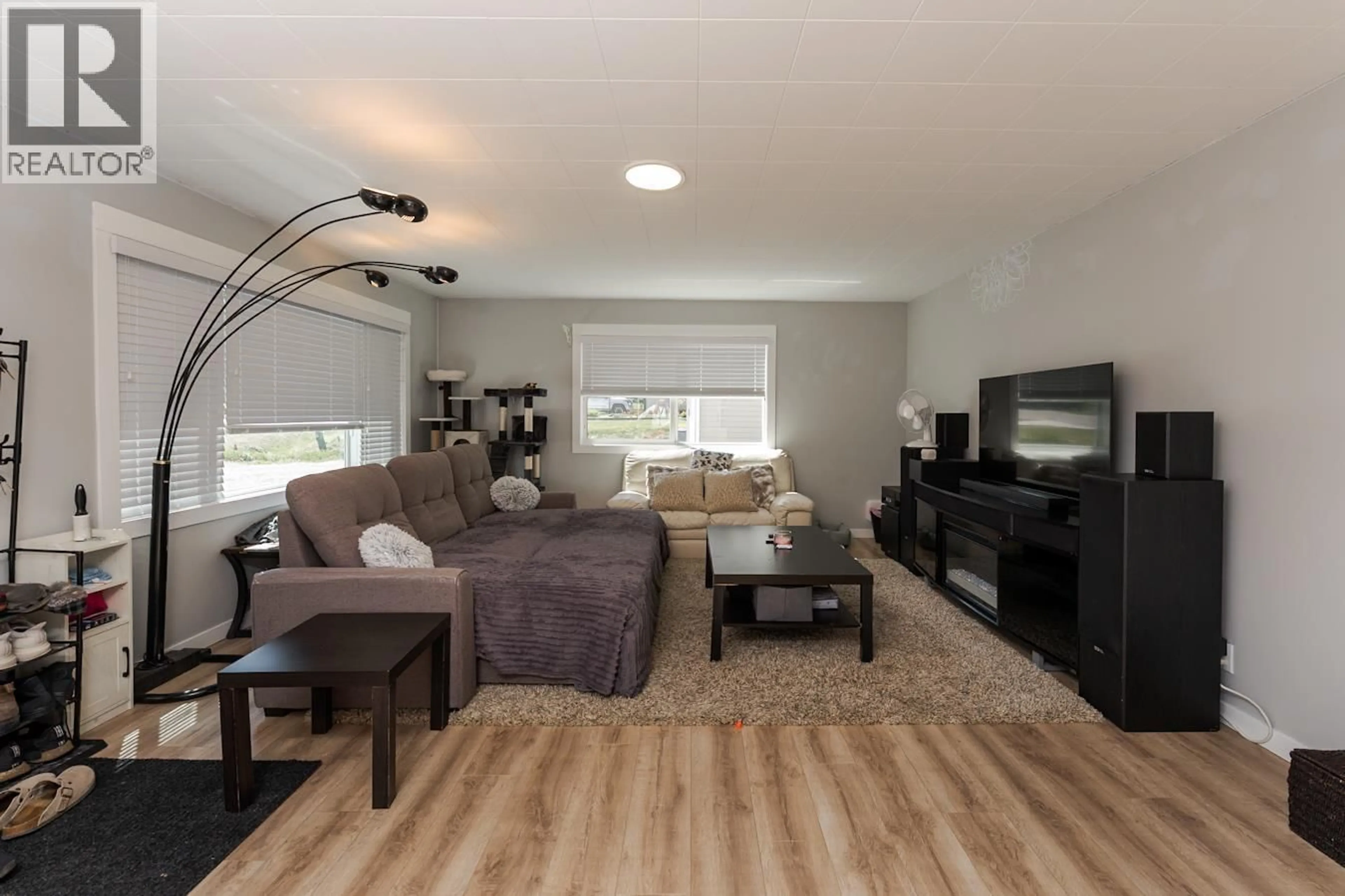 Living room with furniture, wood/laminate floor for 7023 IRENE ROAD, Prince George British Columbia V2N5P2