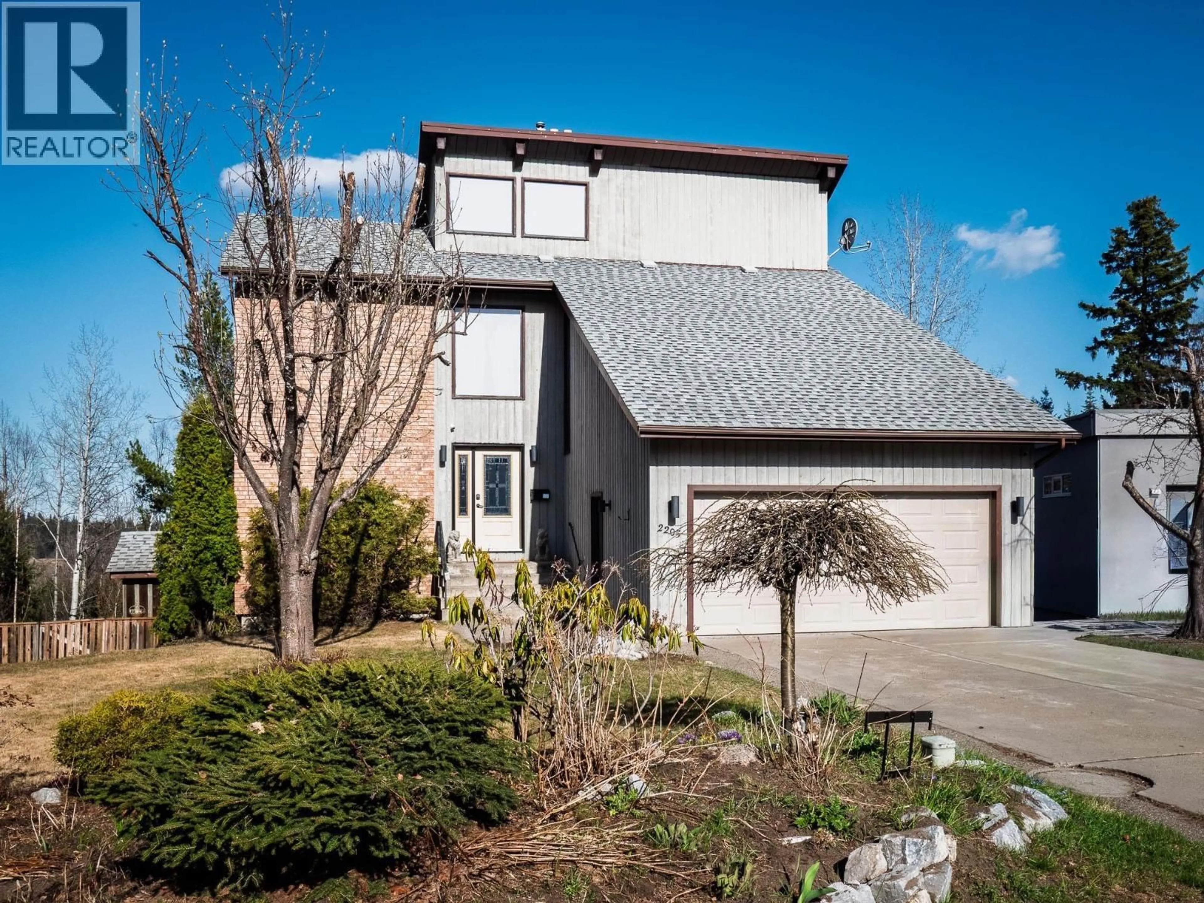 Home with vinyl exterior material, street for 2205 CARLISLE PLACE, Prince George British Columbia V2K4B8