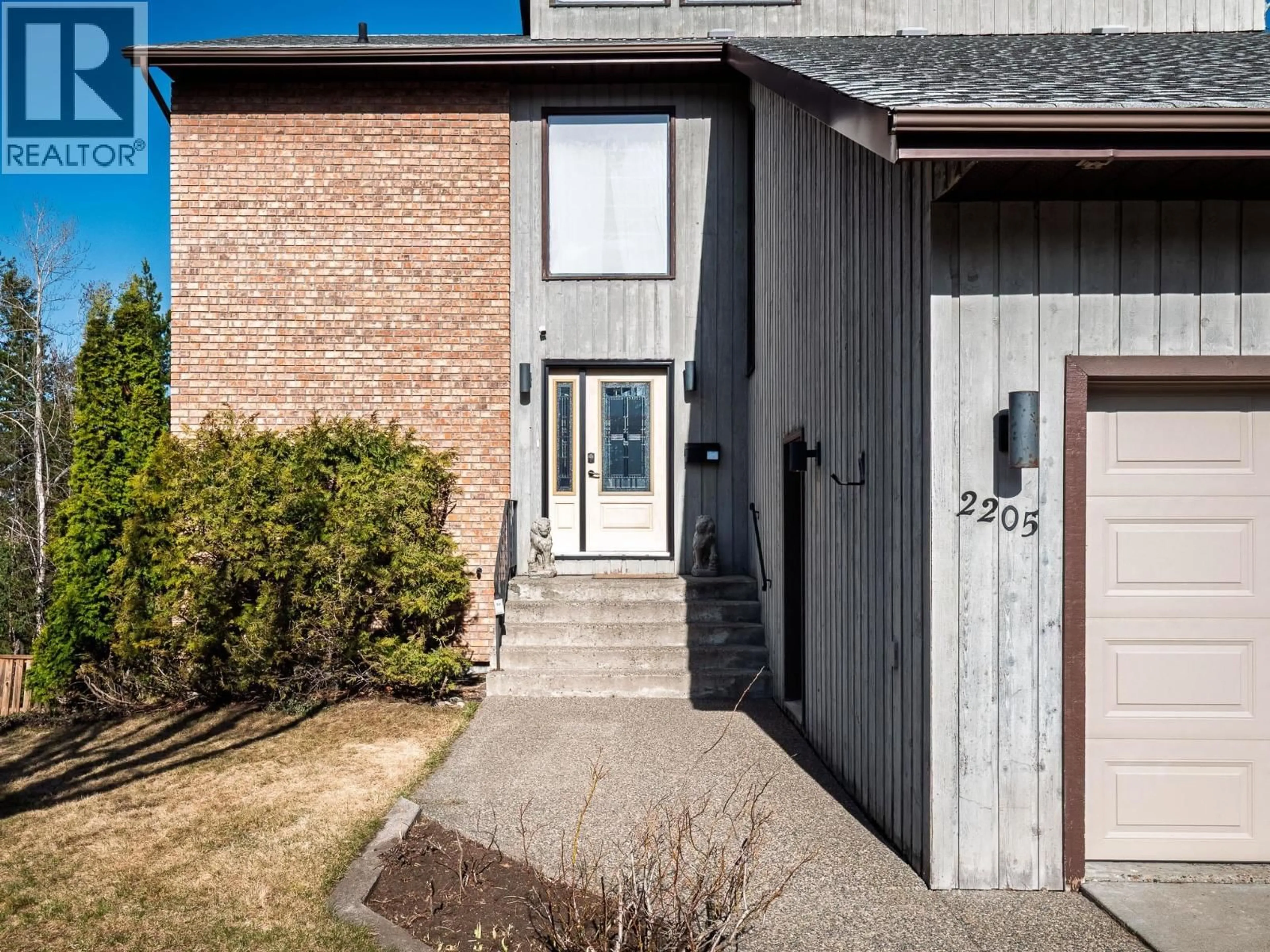 Home with brick exterior material, street for 2205 CARLISLE PLACE, Prince George British Columbia V2K4B8