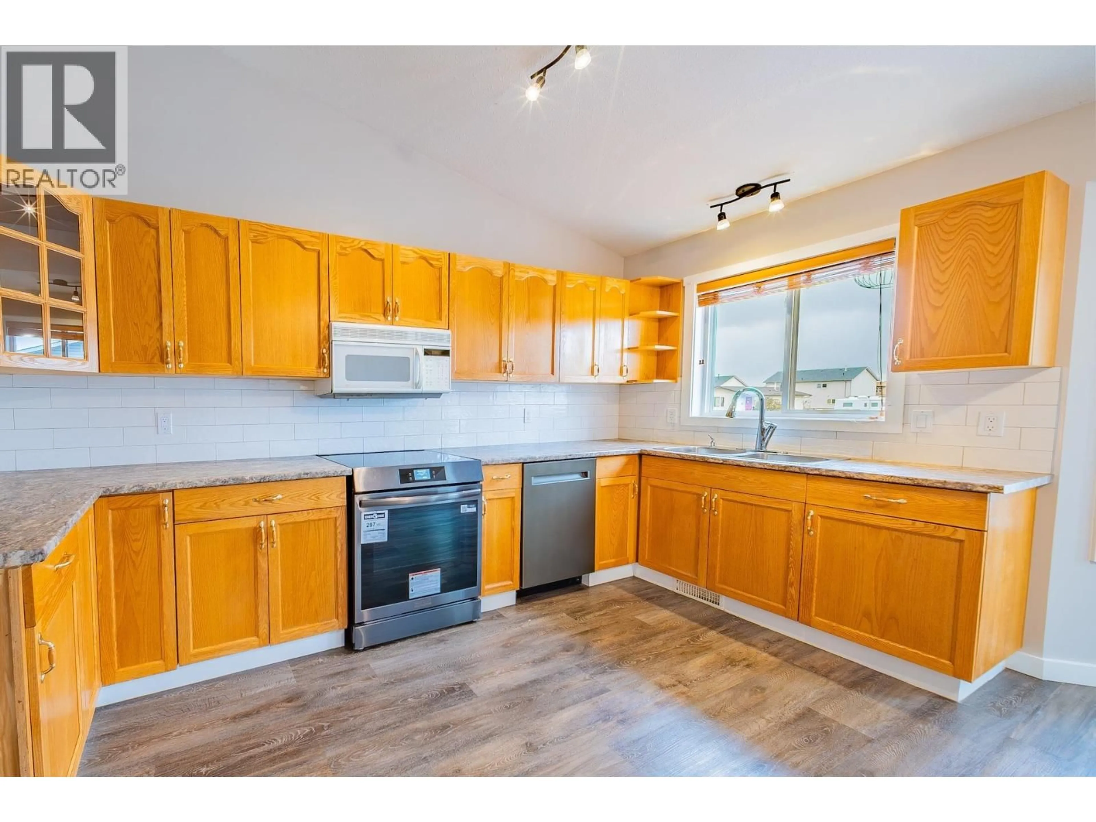 Standard kitchen, wood/laminate floor for 10411 90 STREET, Fort St. John British Columbia V1J6S6