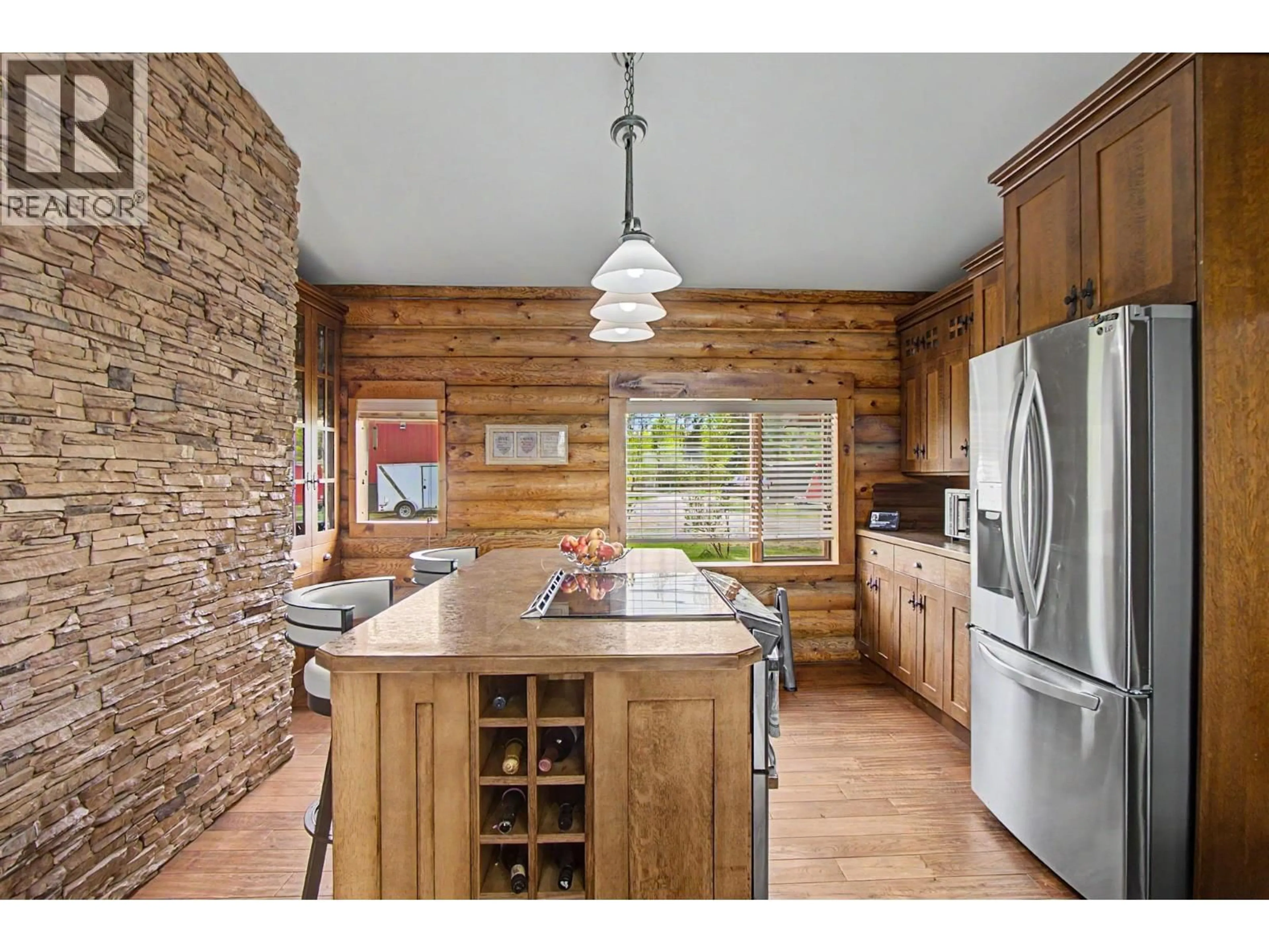 Rustic kitchen, wood/laminate floor for 15110 NUKKO LAKE ESTATES ROAD, Nukko Lake British Columbia V2K5K7