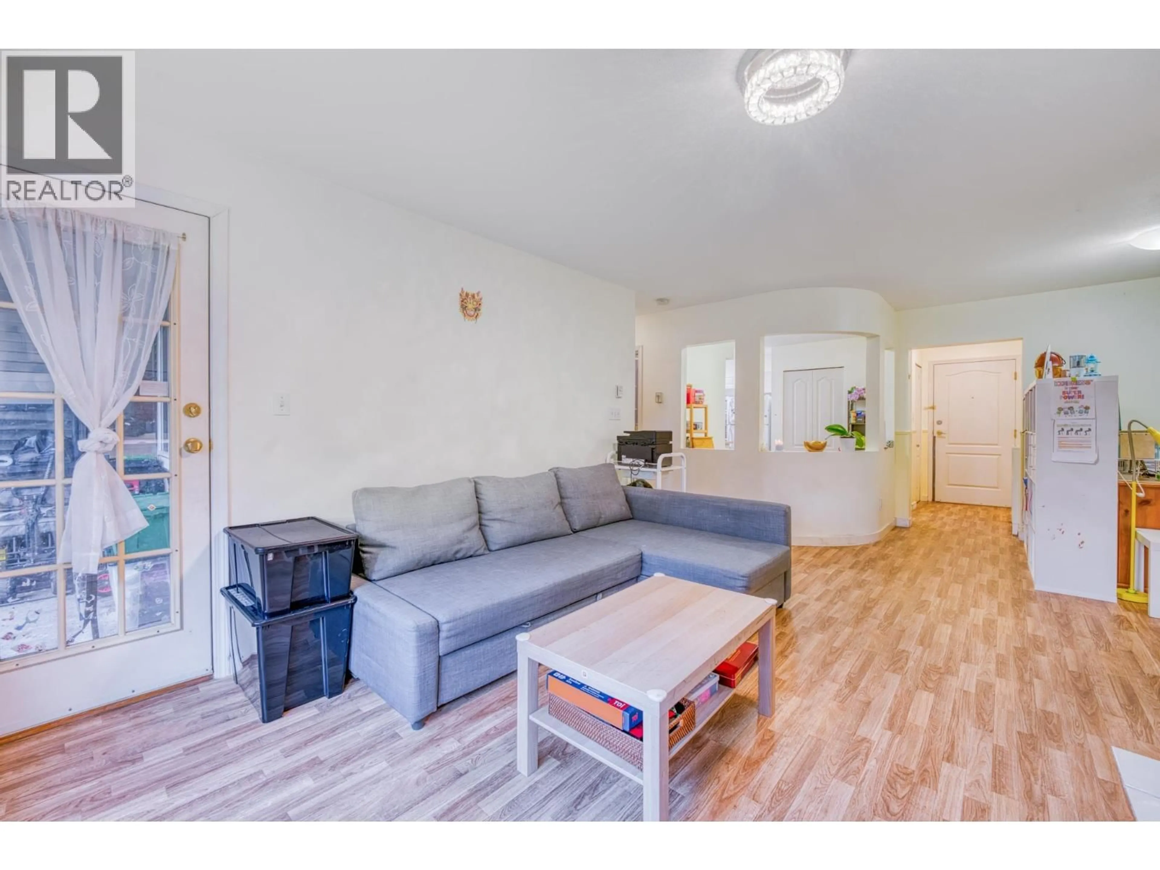Living room with furniture, wood/laminate floor for 207 - 3738 NORFOLK STREET, Burnaby British Columbia V5G4V4