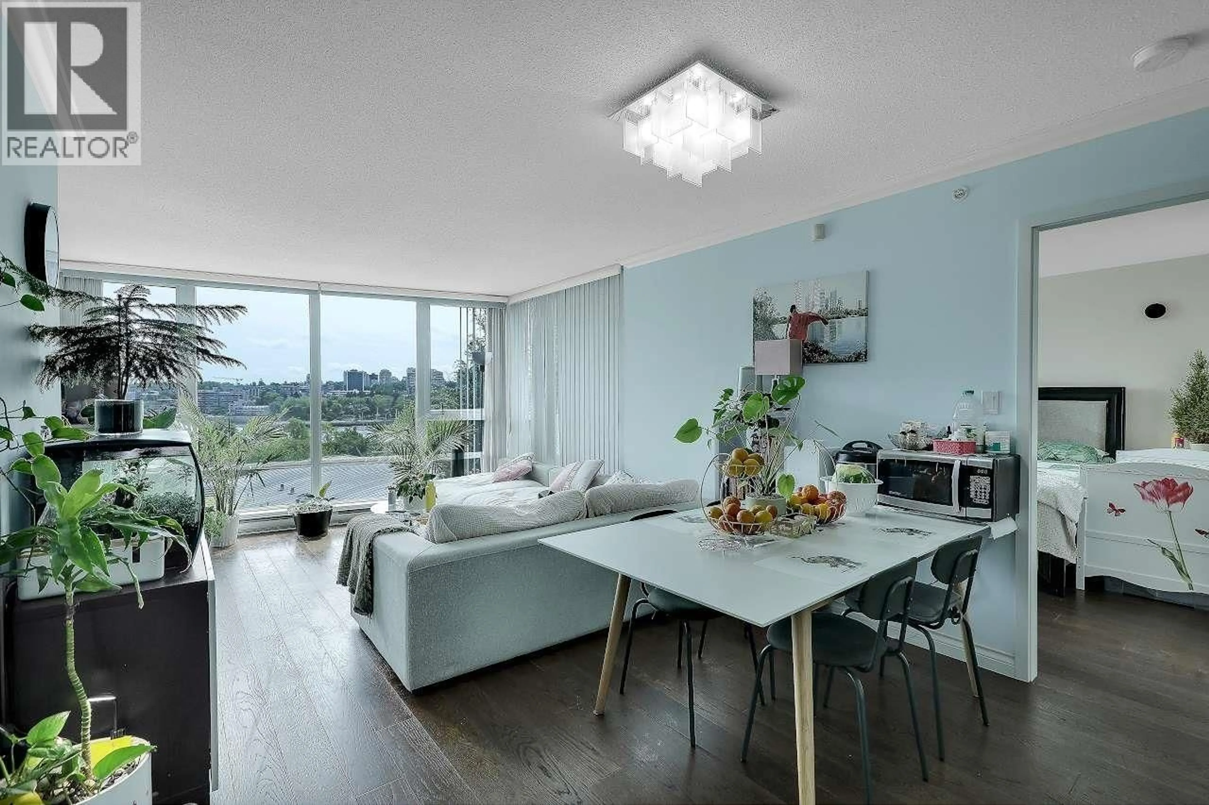 Living room with furniture, wood/laminate floor for 601 - 1408 STRATHMORE MEWS, Vancouver British Columbia V6Z3A9