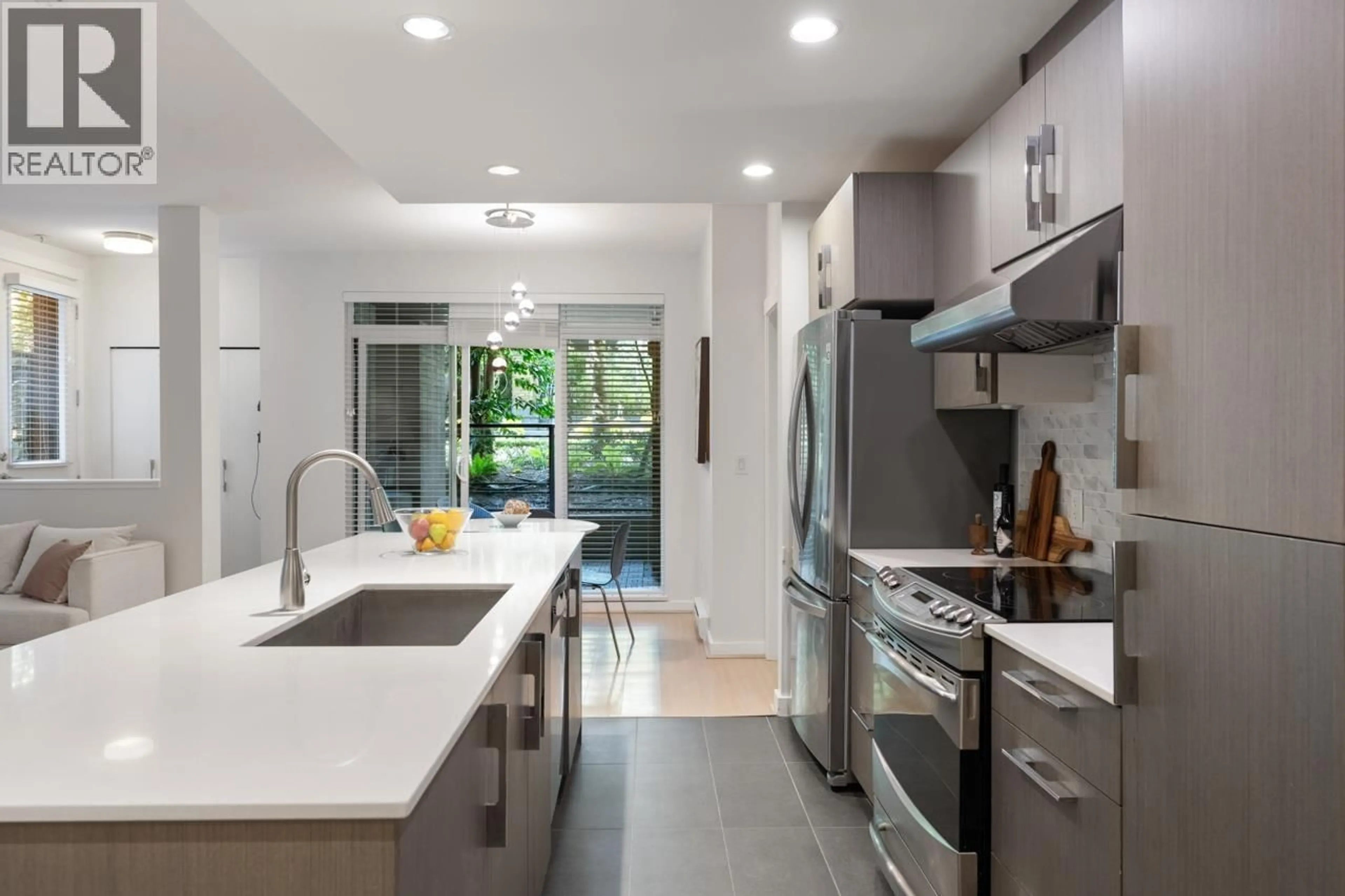 Contemporary kitchen, ceramic/tile floor for 105 - 3479 WESBROOK MALL, Vancouver British Columbia V6S0B7