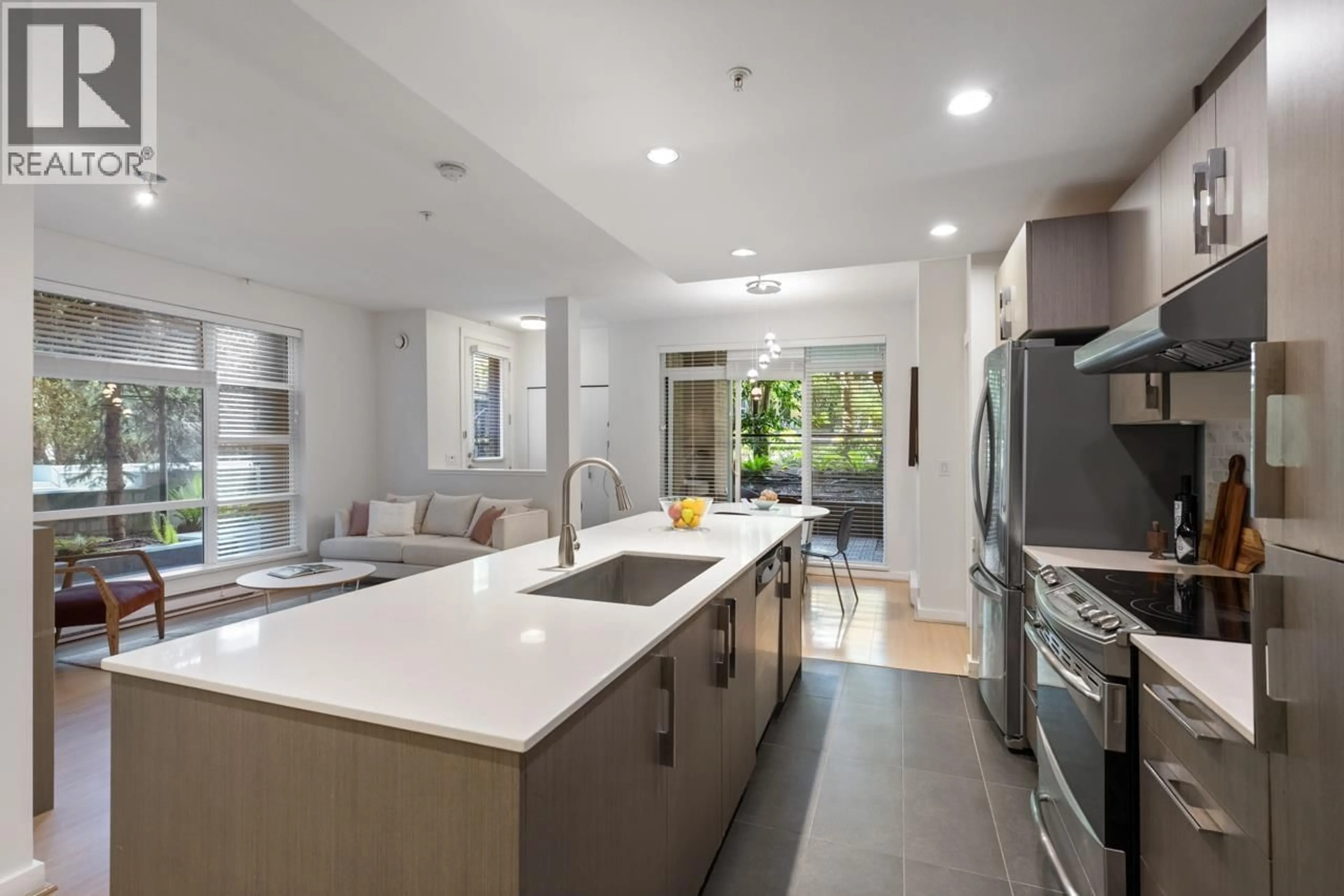 Open concept kitchen, ceramic/tile floor for 105 - 3479 WESBROOK MALL, Vancouver British Columbia V6S0B7