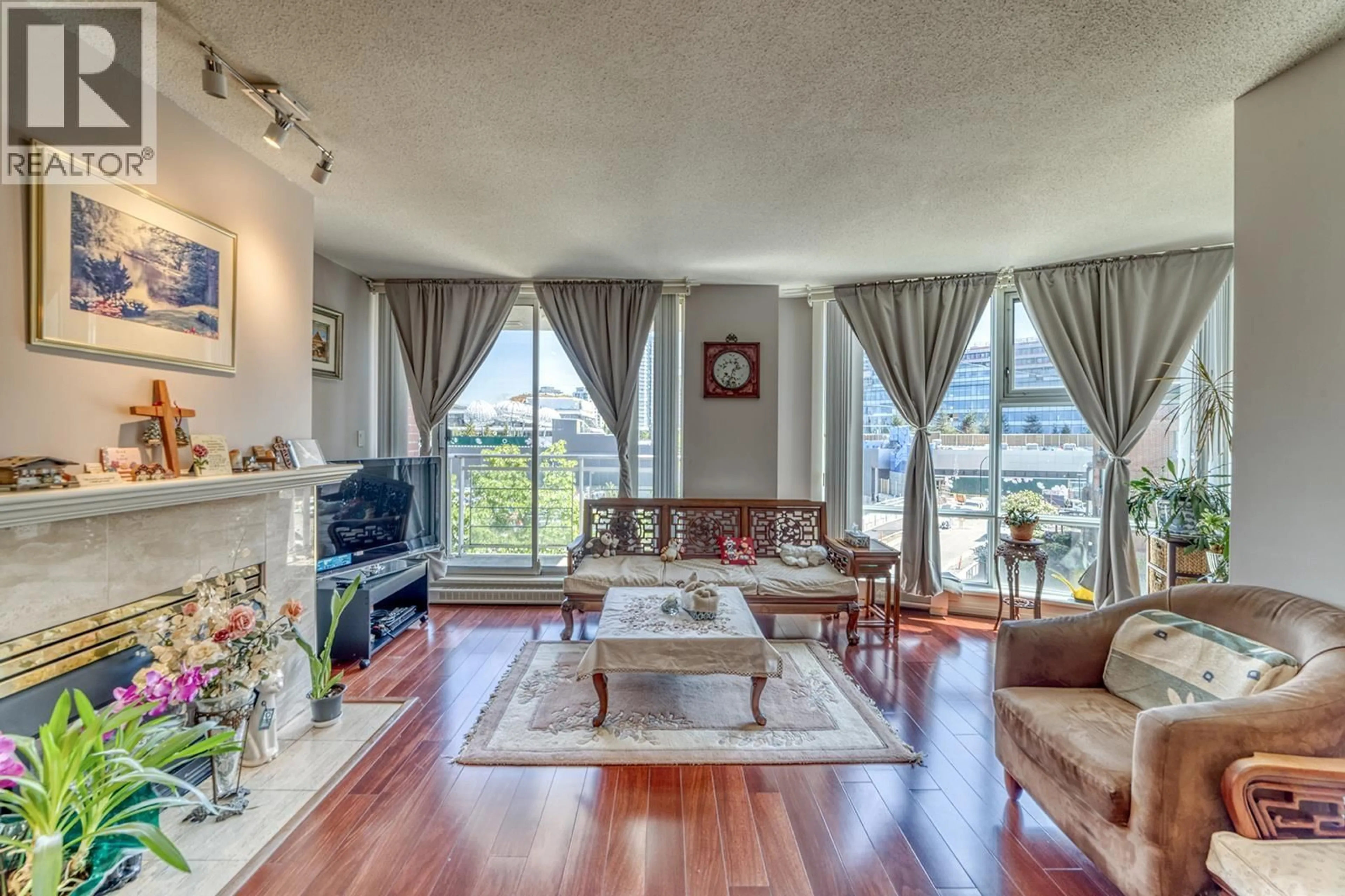 Living room with furniture, unknown for 403 - 688 FAIRCHILD ROAD, Vancouver British Columbia V5Z4P7