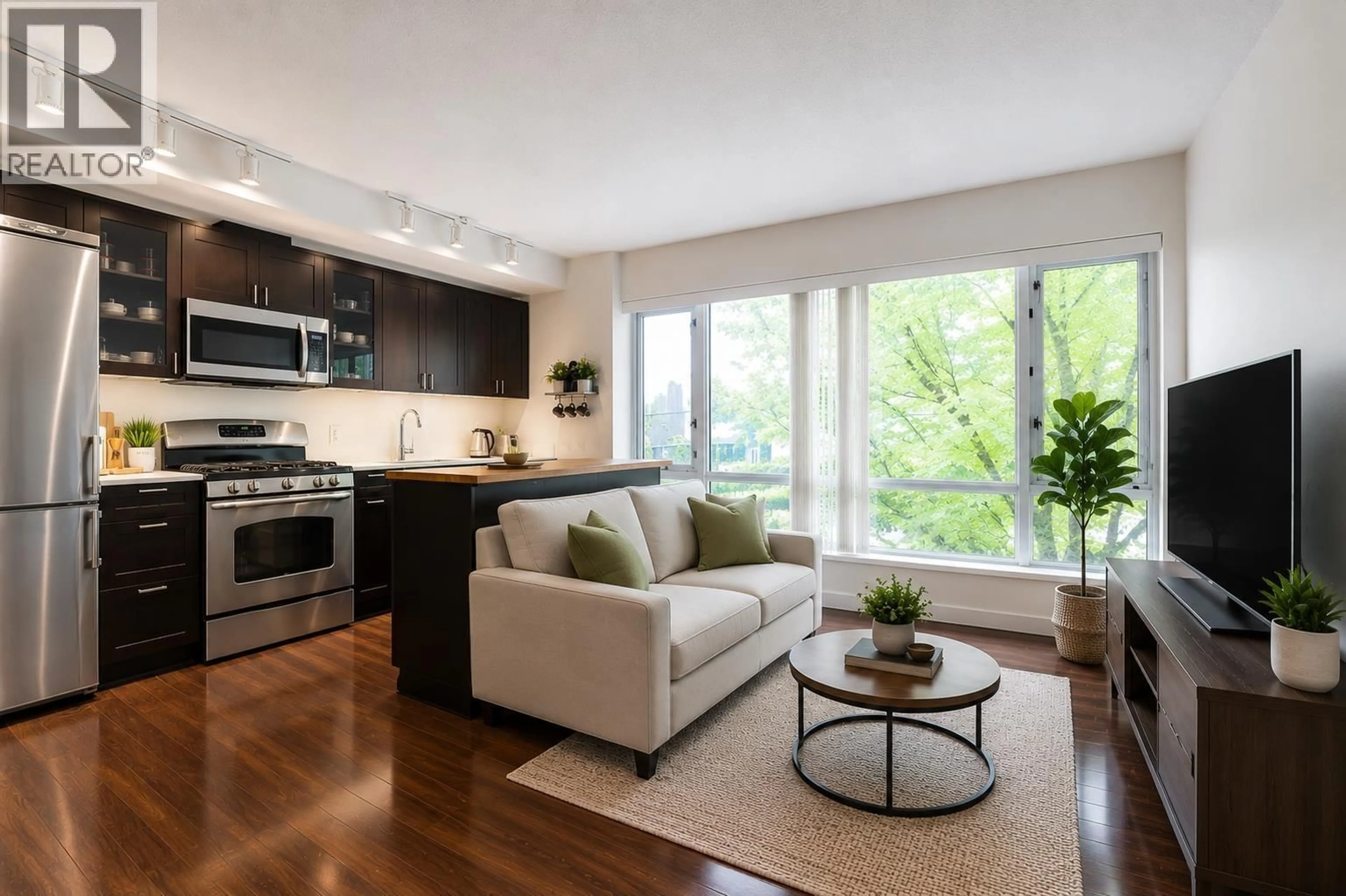 Open concept kitchen, wood/laminate floor for 201 - 4888 NANAIMO STREET, Vancouver British Columbia V5N0B5