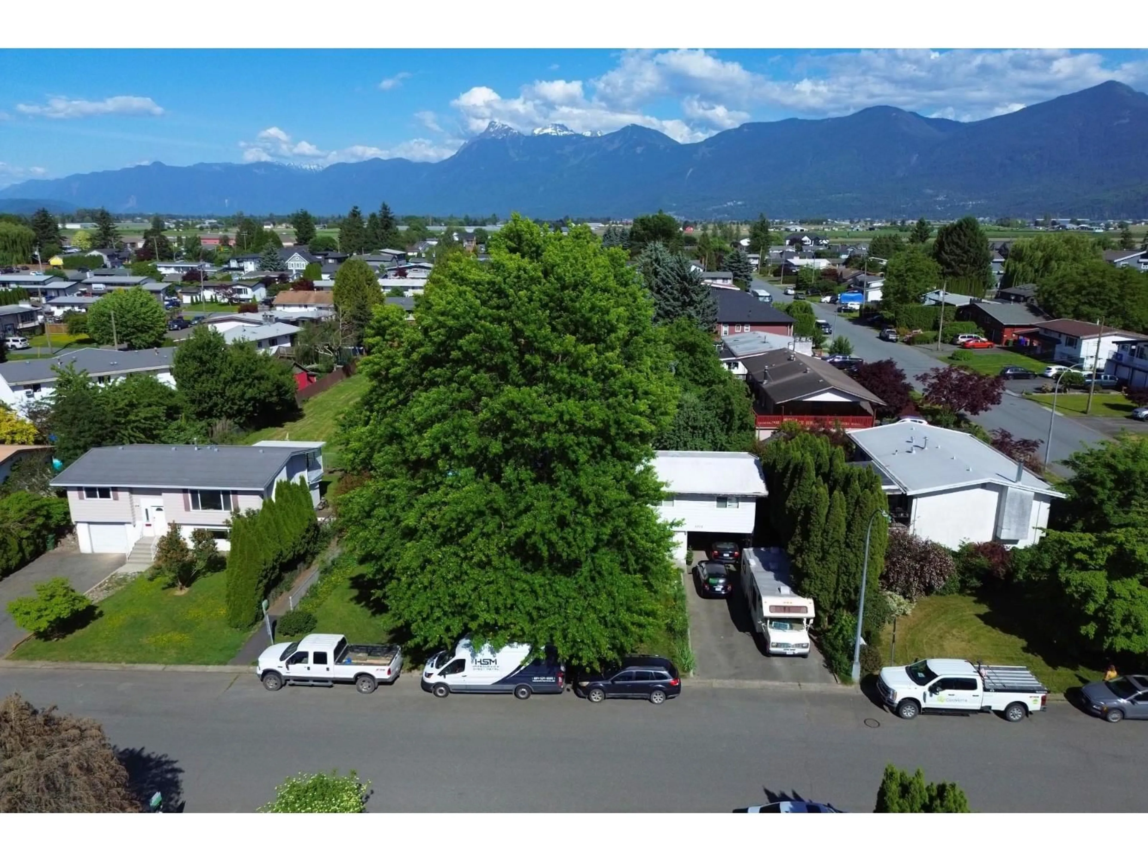 A pic from outside/outdoor area/front of a property/back of a property/a pic from drone, mountain view for 8708 CORNWALL CRESCENT, Chilliwack British Columbia V2P7E6