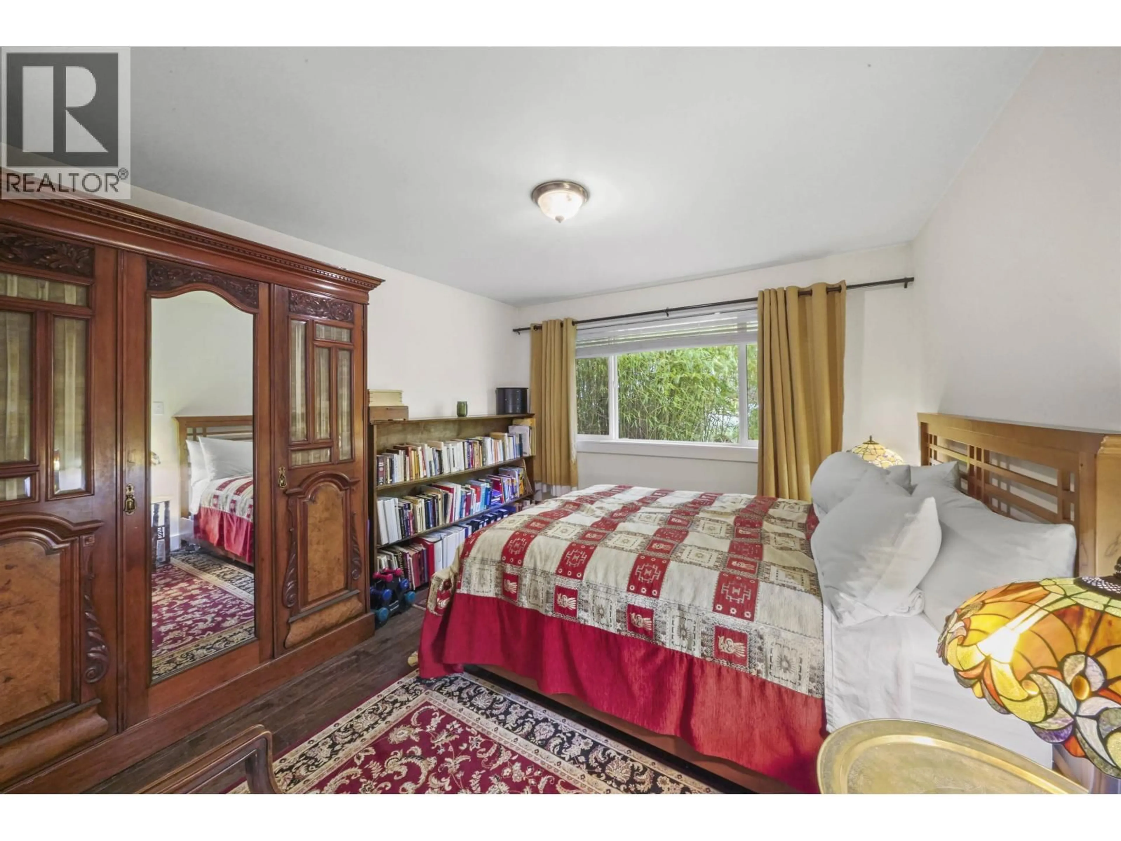 Bedroom with bed, wood/laminate floor for 2850 6TH AVENUE, Vancouver British Columbia V5M1R8