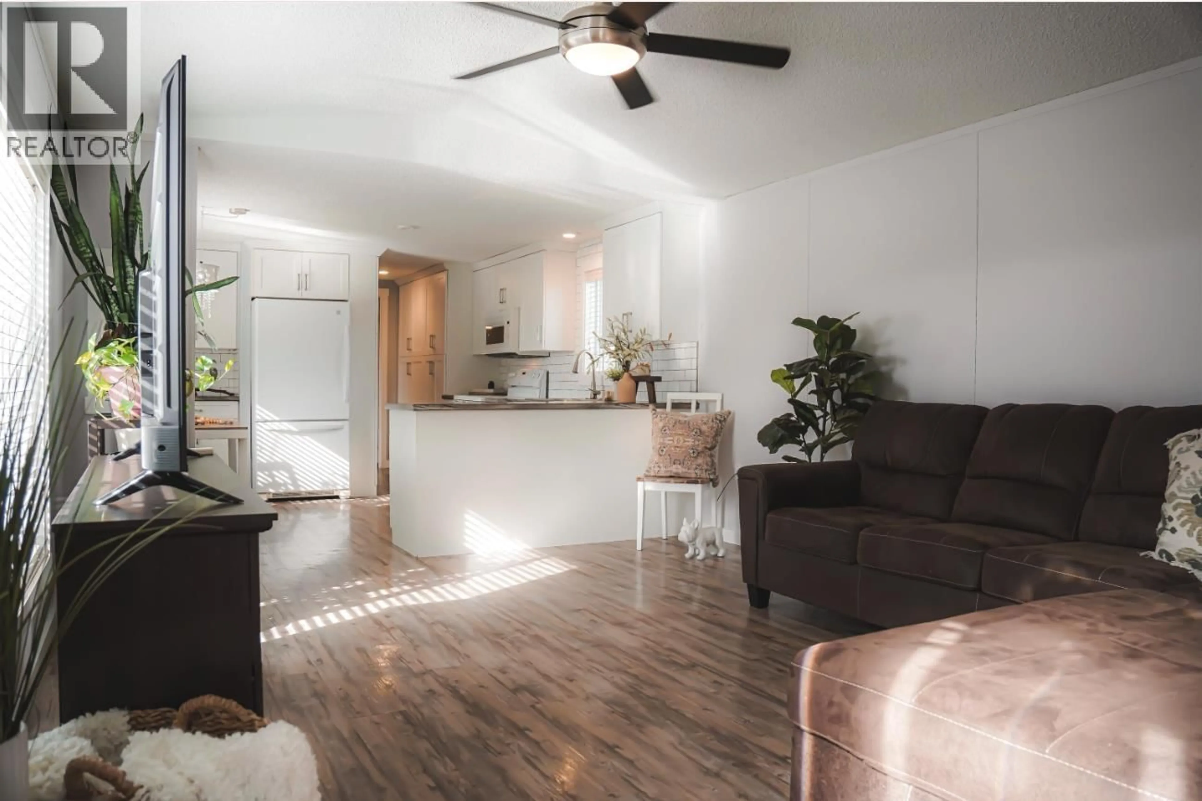 Open concept kitchen, wood/laminate floor for 12478 RIMROCK DRIVE, Charlie Lake British Columbia V0C1H0