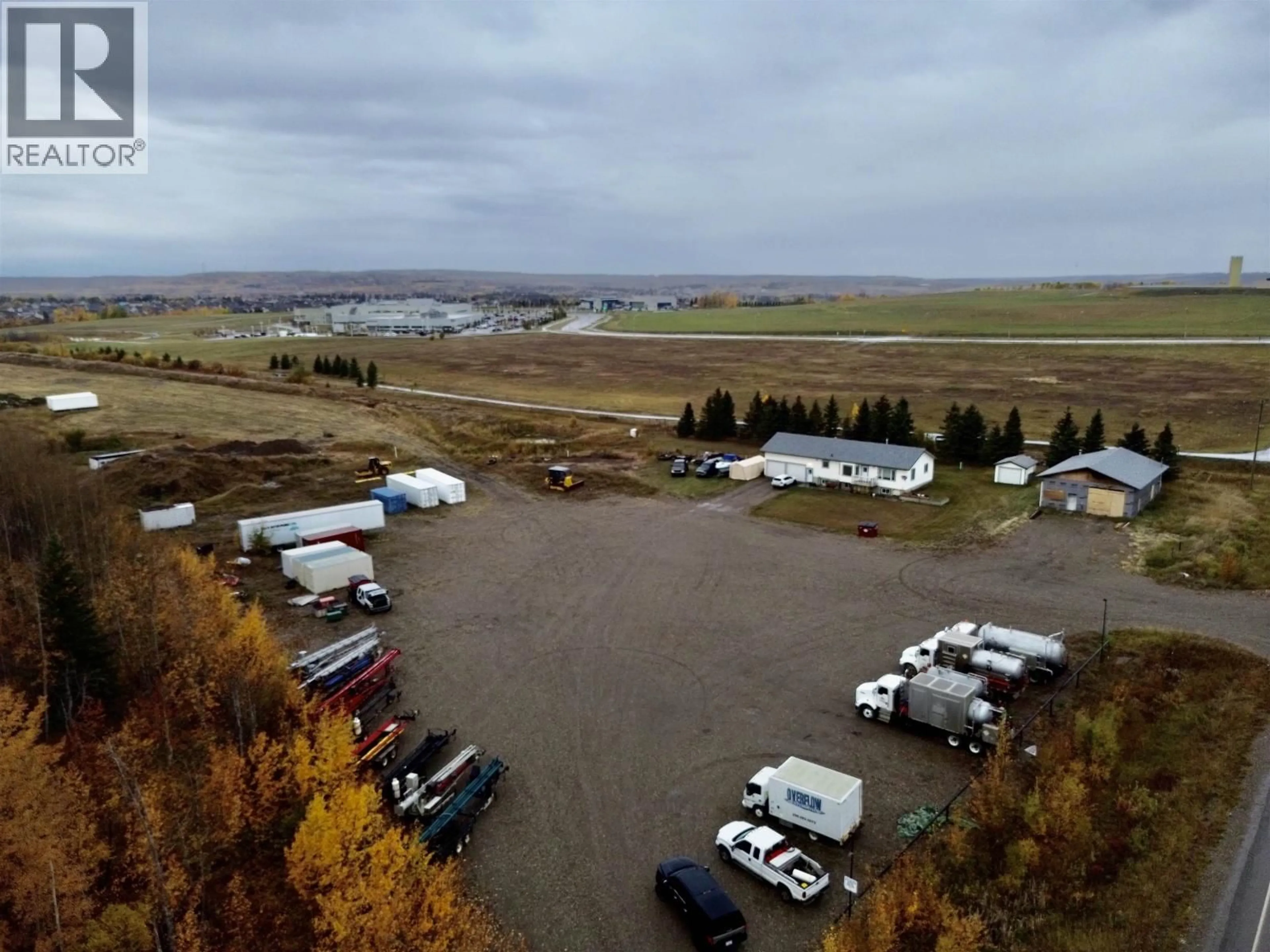 A pic from outside/outdoor area/front of a property/back of a property/a pic from drone, mountain view for 10720 NORTHERN LIGHTS DRIVE, Fort St. John British Columbia V1J0S8