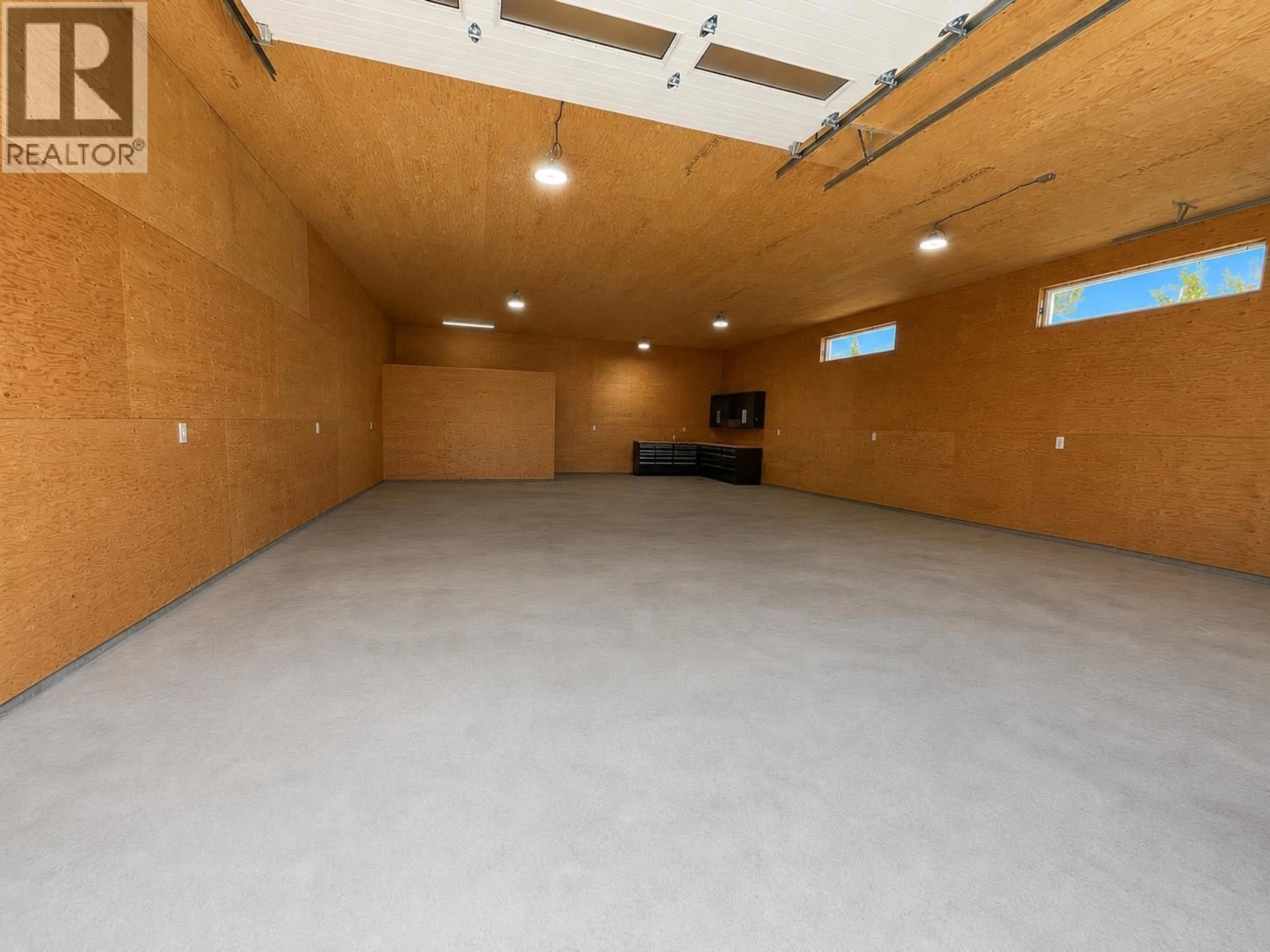 Indoor garage for 10720 NORTHERN LIGHTS DRIVE, Fort St. John British Columbia V1J0S8