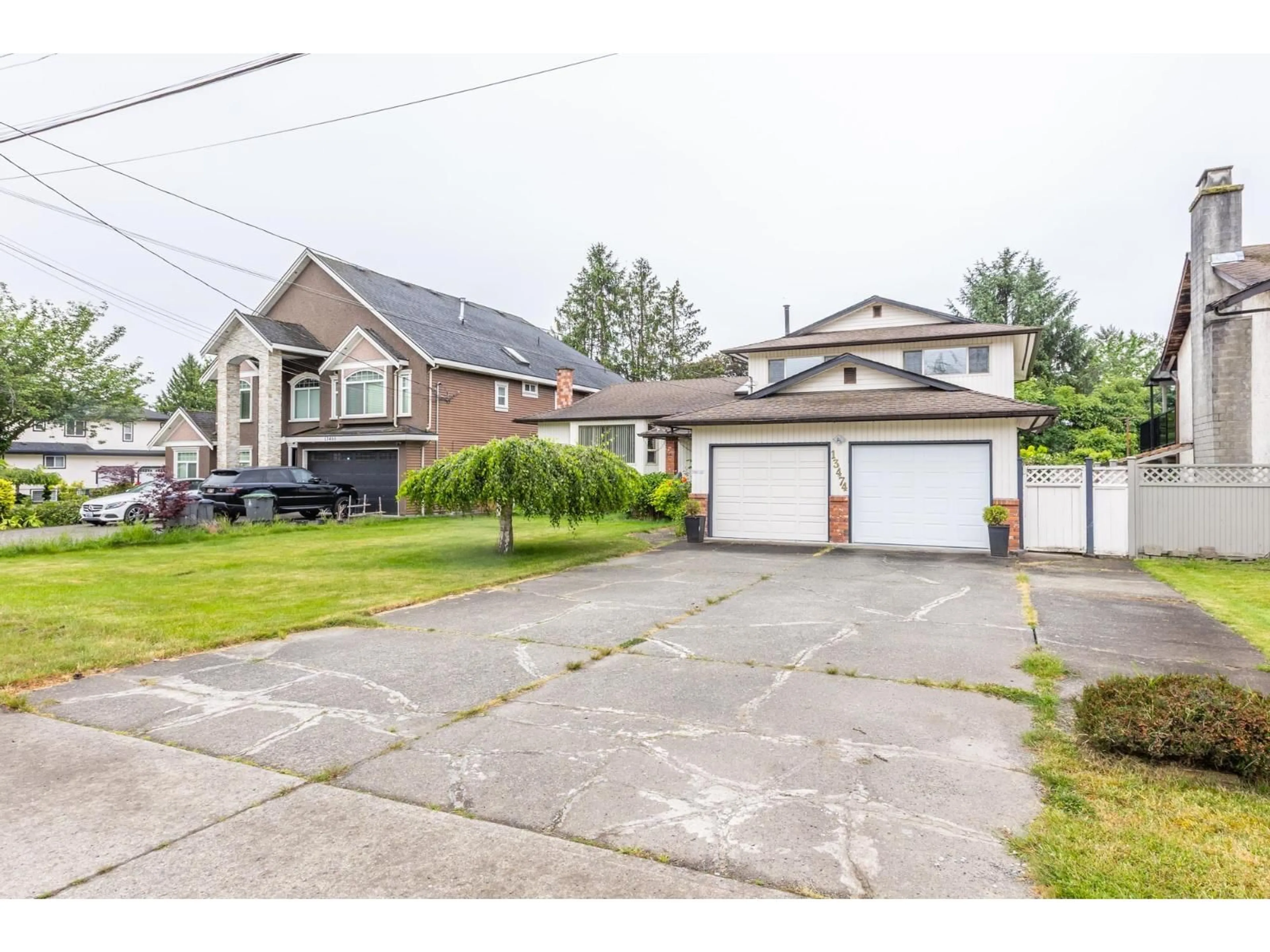 A pic from outside/outdoor area/front of a property/back of a property/a pic from drone, street for 13474 67 AVENUE, Surrey British Columbia V3W6L9