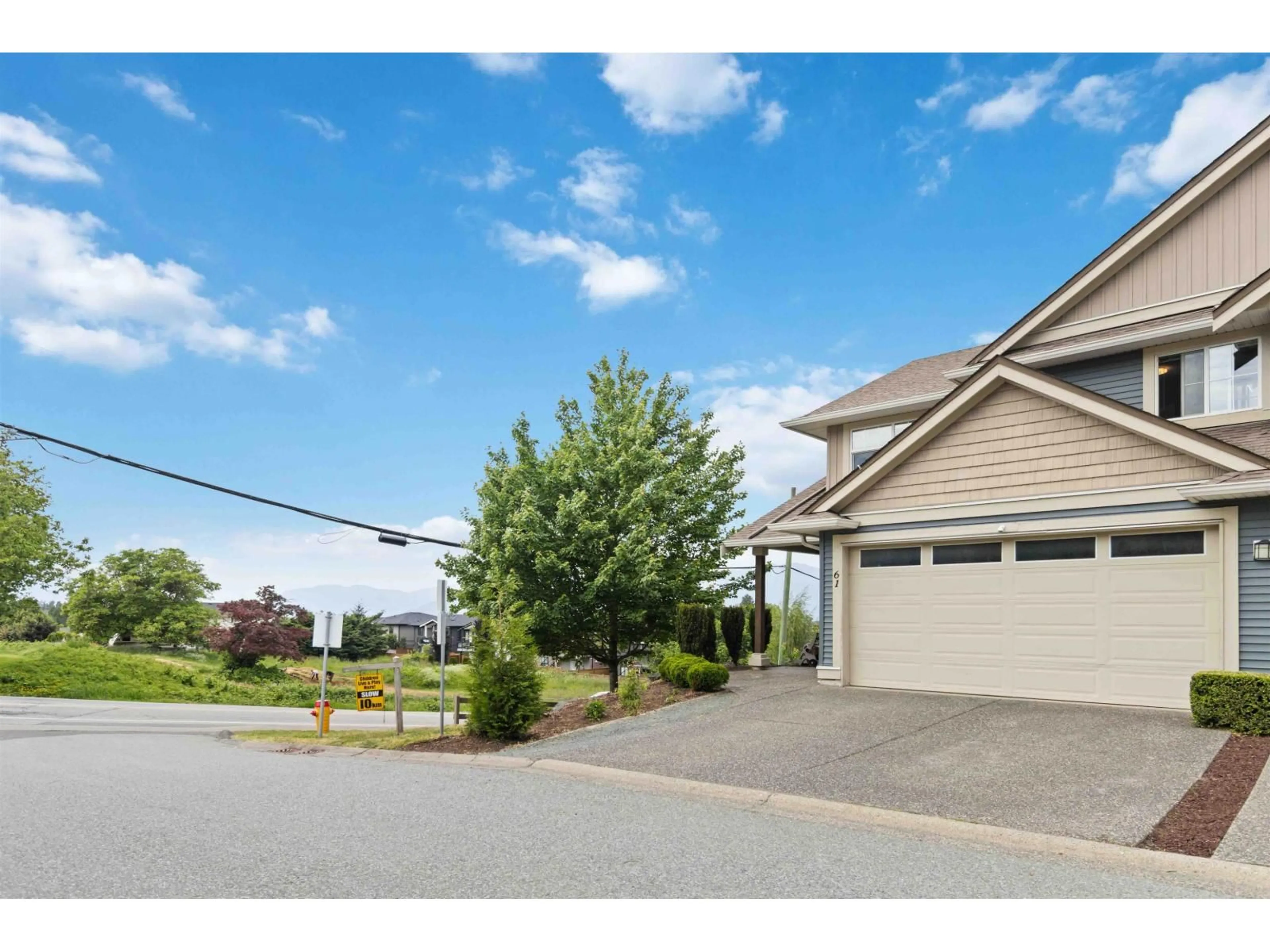 A pic from outside/outdoor area/front of a property/back of a property/a pic from drone, street for 61 - 5648 PROMONTORY ROAD, Sardis British Columbia V2R0E5