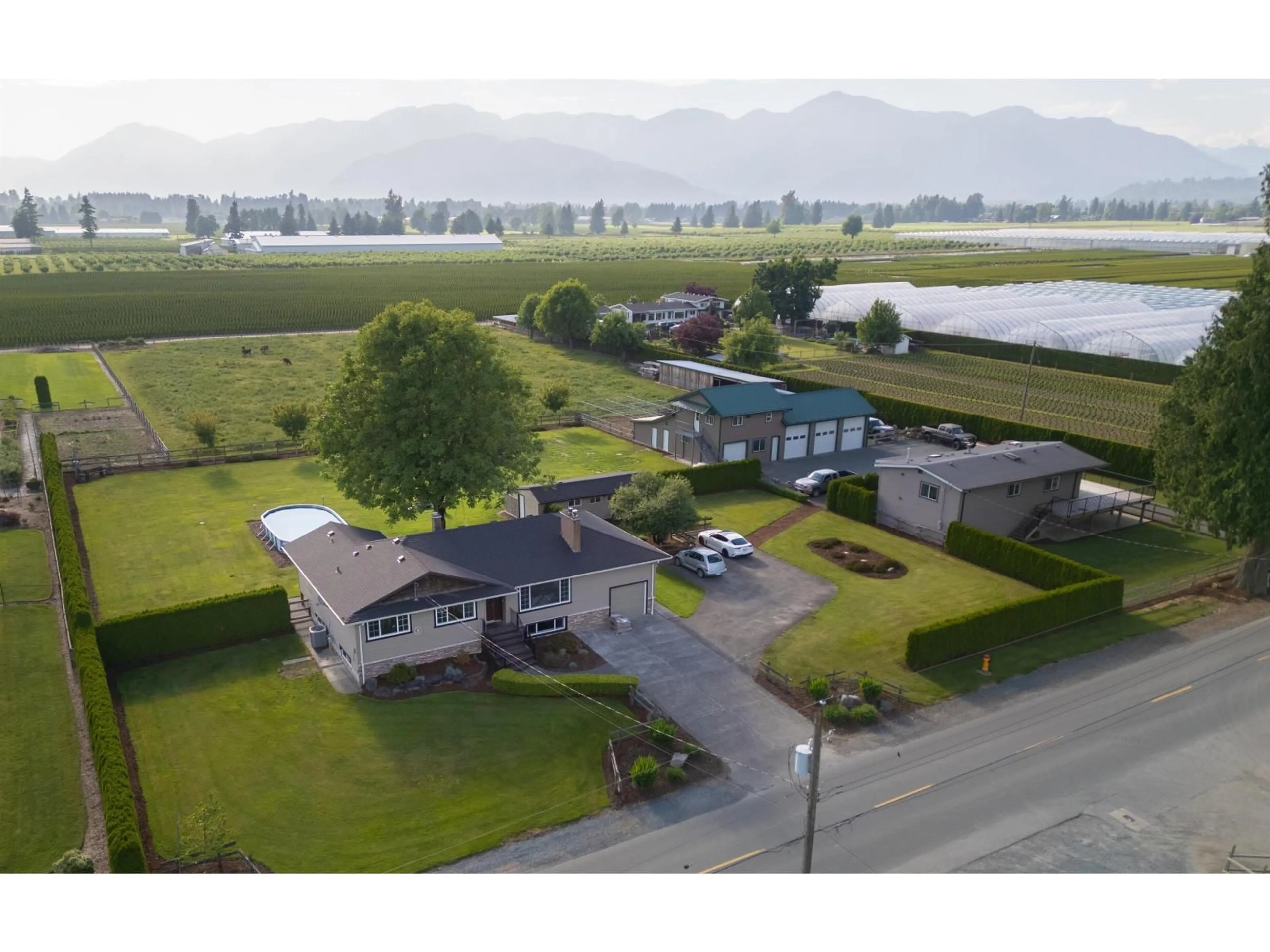 A pic from outside/outdoor area/front of a property/back of a property/a pic from drone, mountain view for 10195 GILLANDERS ROAD, Chilliwack British Columbia V2P6H4