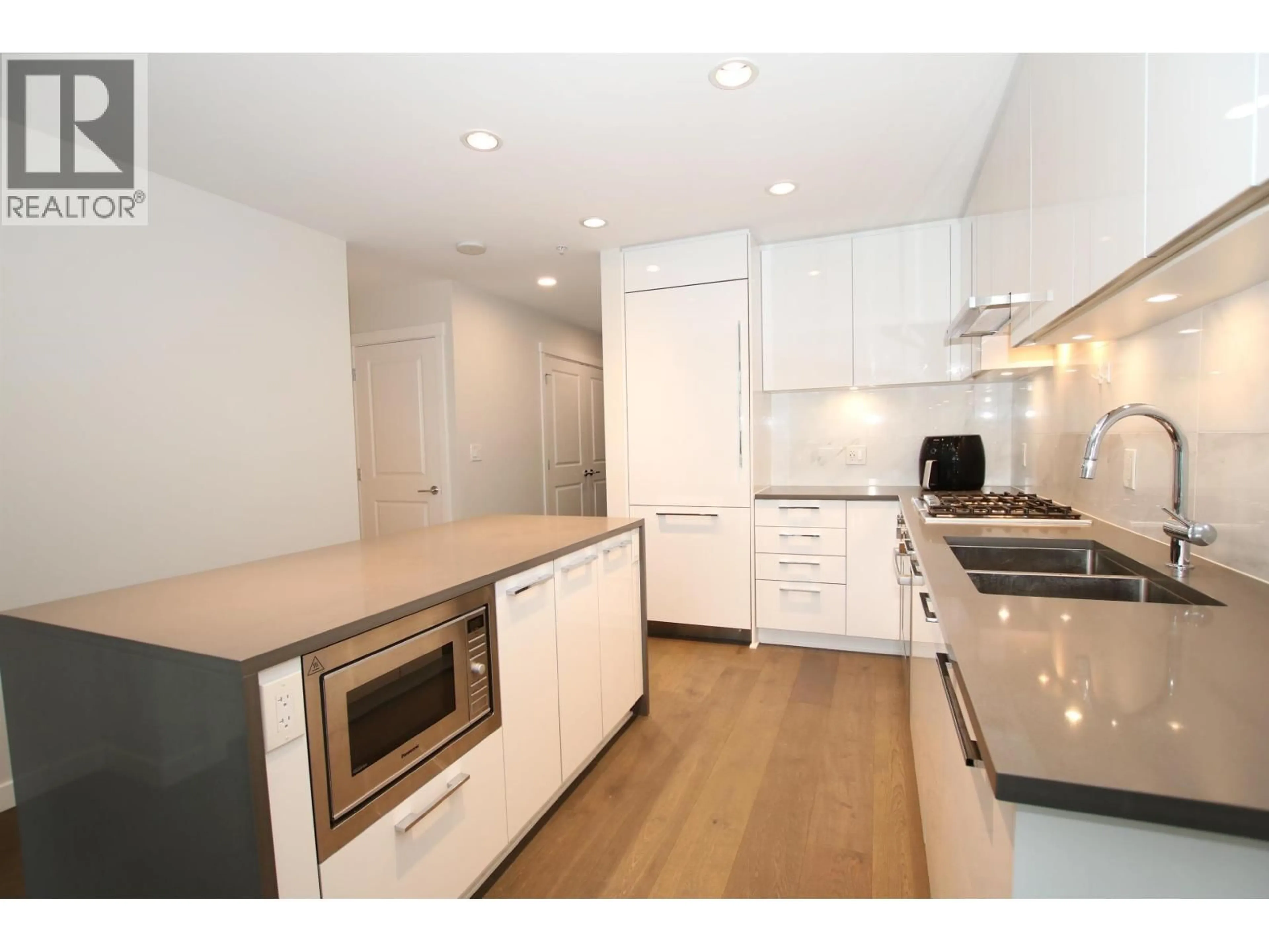 Open concept kitchen, wood/laminate floor for 1107 - 3487 BINNING ROAD, Vancouver British Columbia V6S0K8