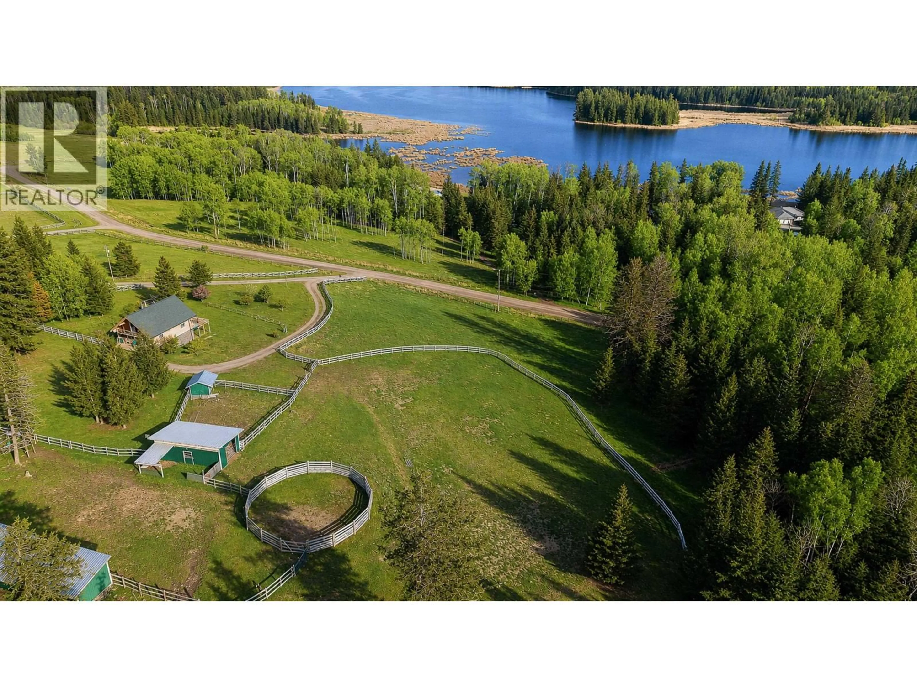 A pic from outside/outdoor area/front of a property/back of a property/a pic from drone, water/lake/river/ocean view for 5785 SIMON LAKE ROAD, 100 Mile House British Columbia V0K2E1