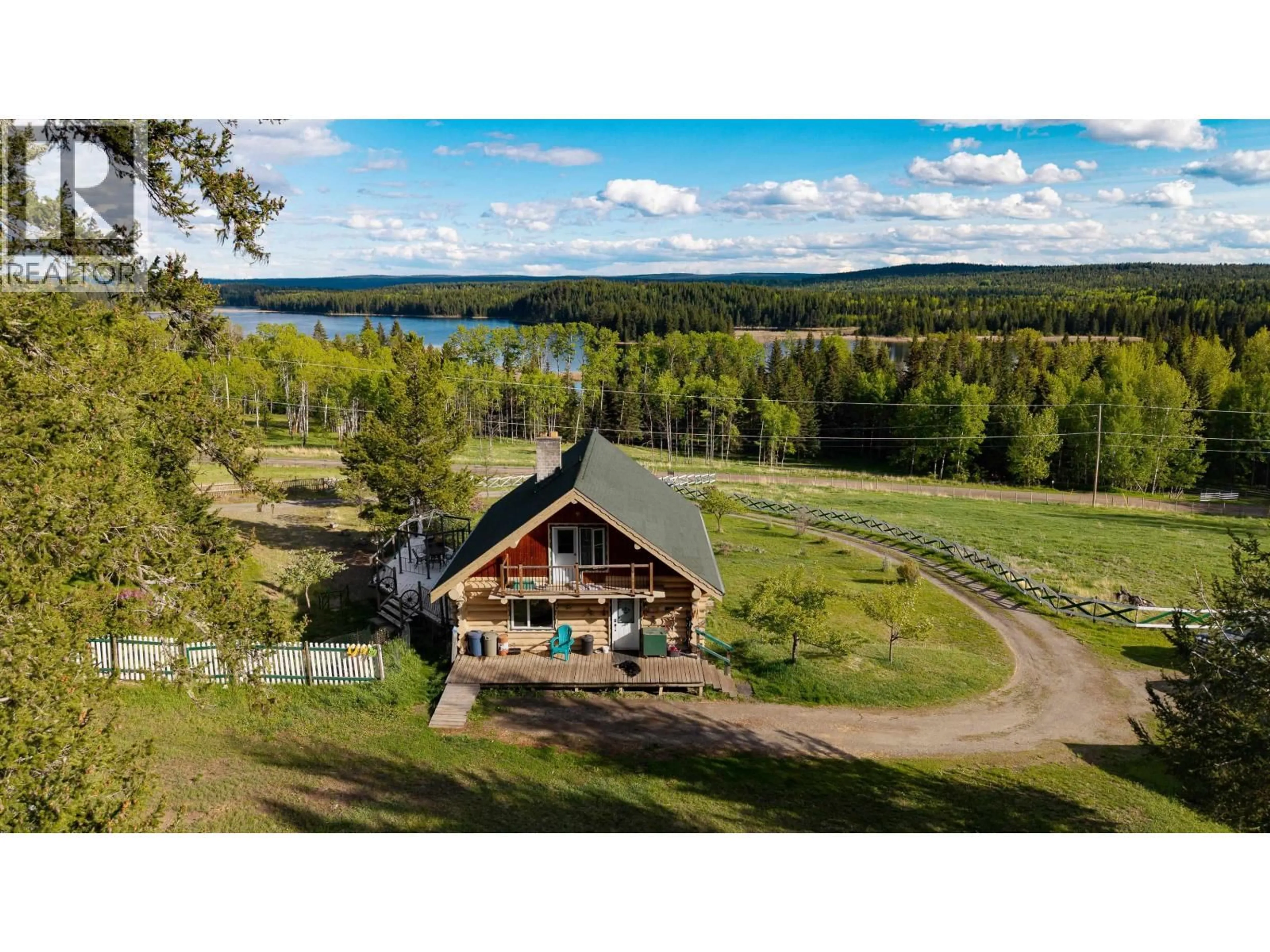 A pic from outside/outdoor area/front of a property/back of a property/a pic from drone, water/lake/river/ocean view for 5785 SIMON LAKE ROAD, 100 Mile House British Columbia V0K2E1