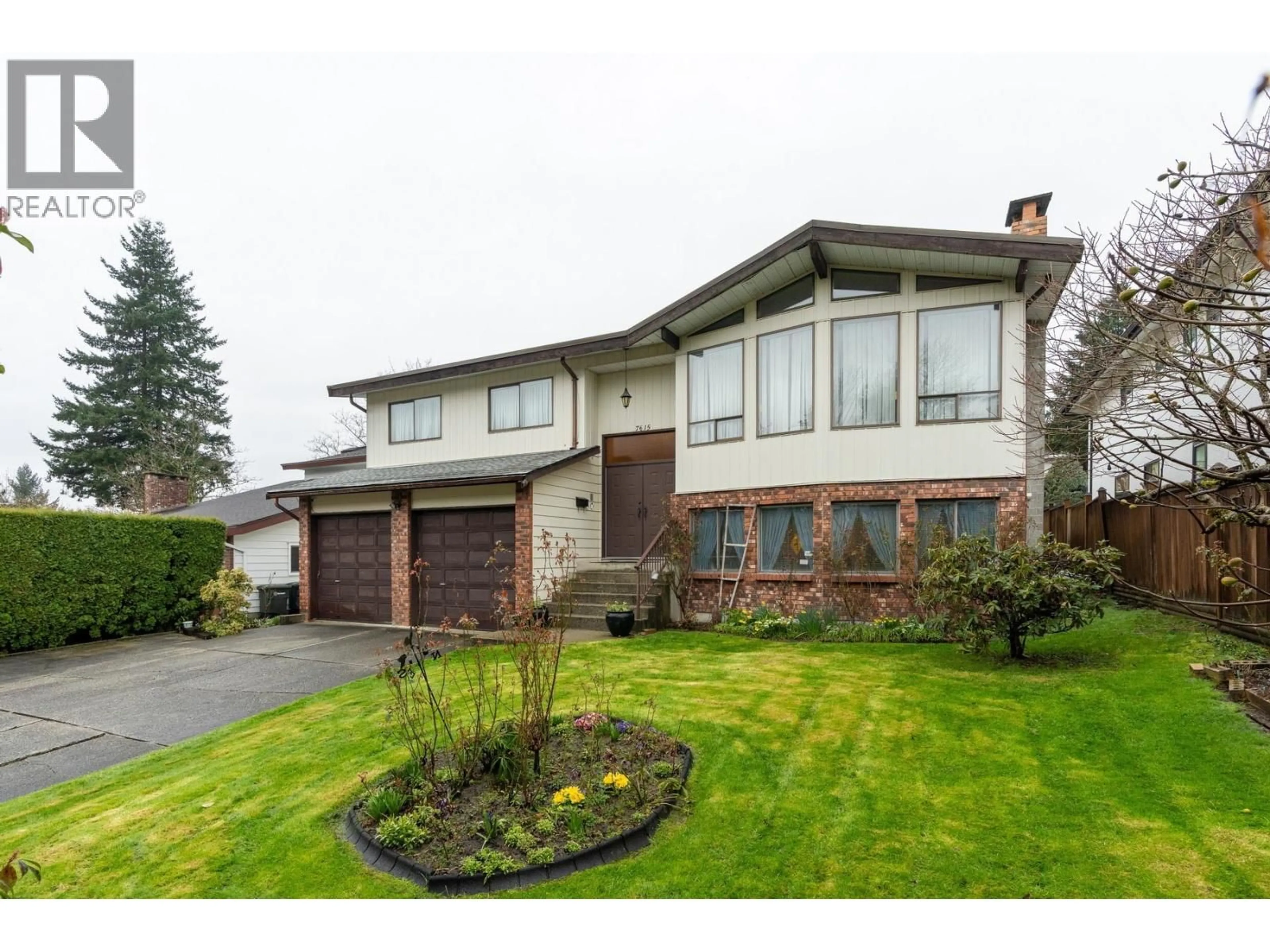 Home with vinyl exterior material, street for 7615 LAWRENCE DRIVE, Burnaby British Columbia V5A3M6