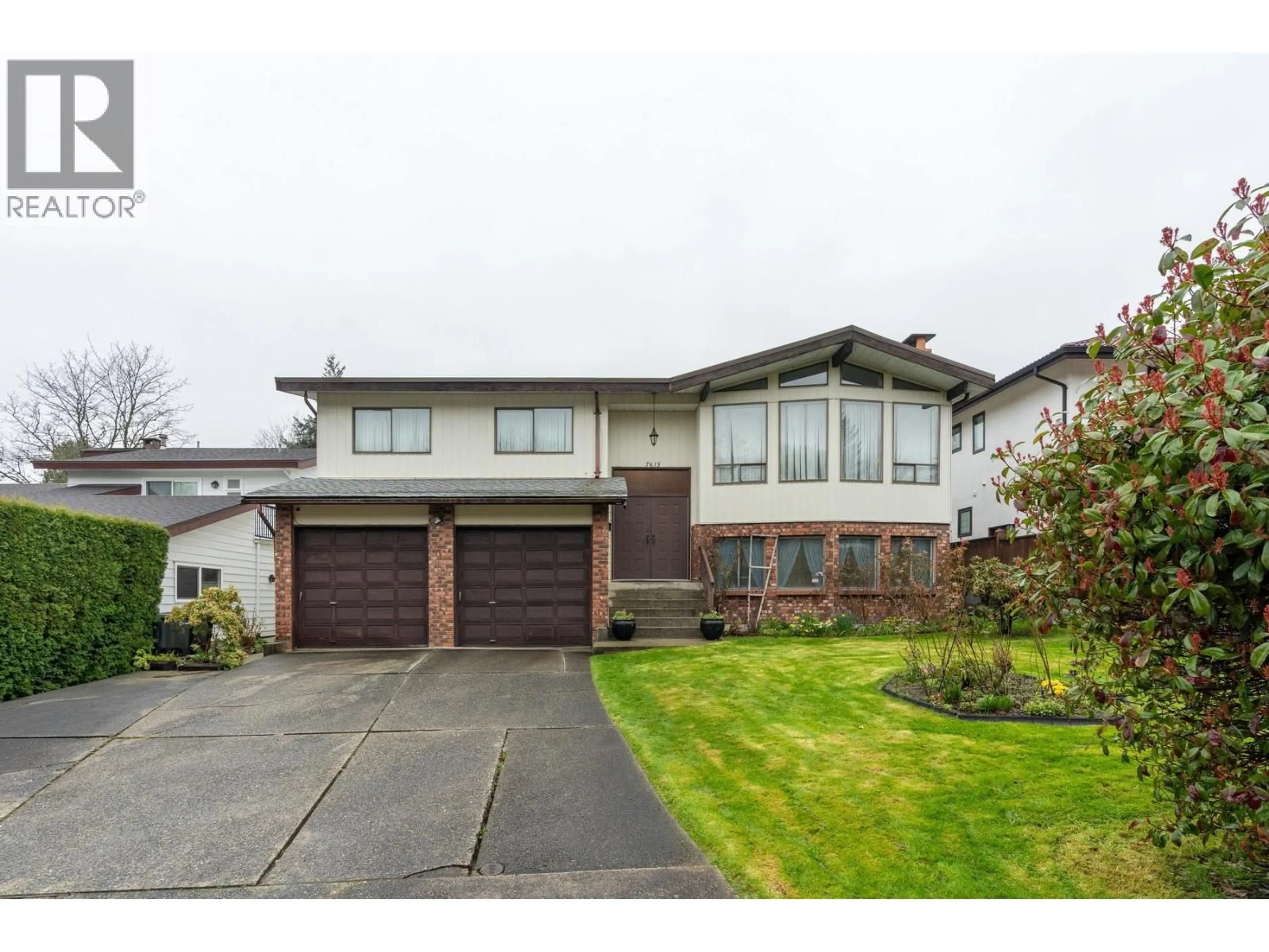 Home with vinyl exterior material, street for 7615 LAWRENCE DRIVE, Burnaby British Columbia V5A3M6