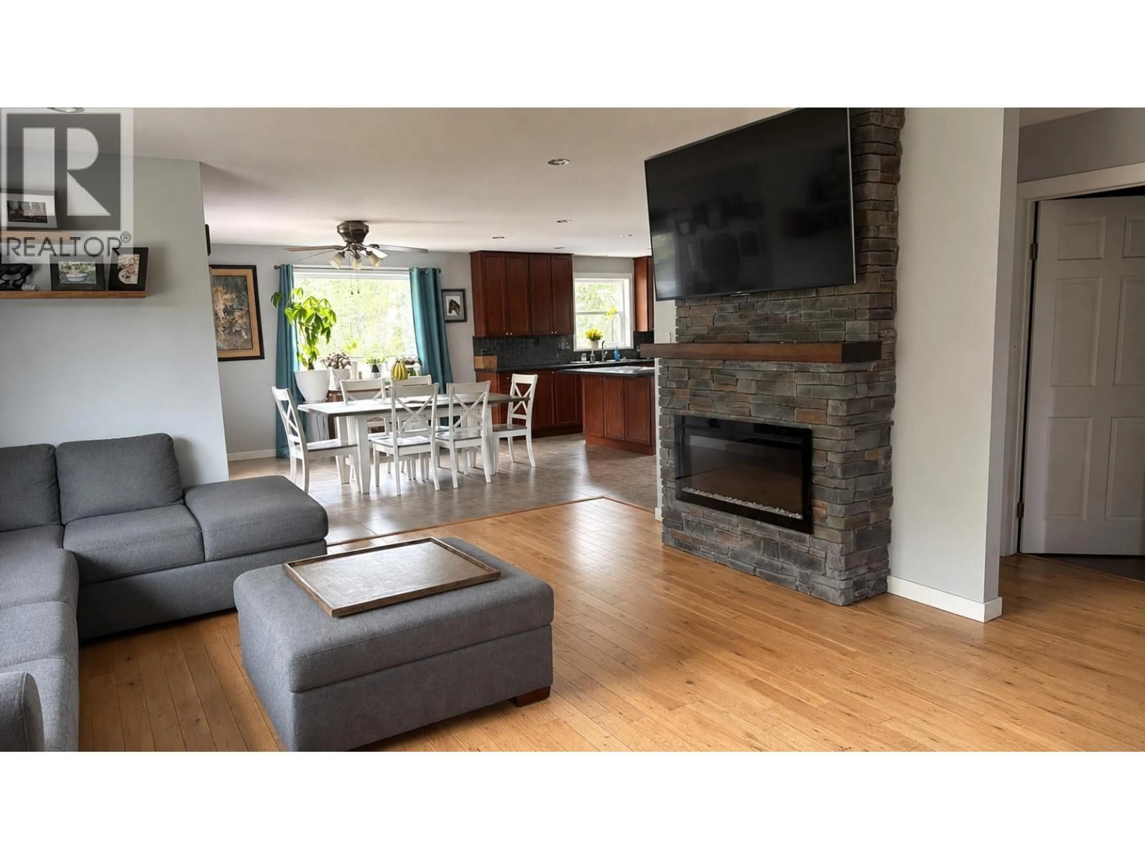 Living room with furniture, wood/laminate floor for 8855 SYKES ROAD, Prince George British Columbia V2N6N5