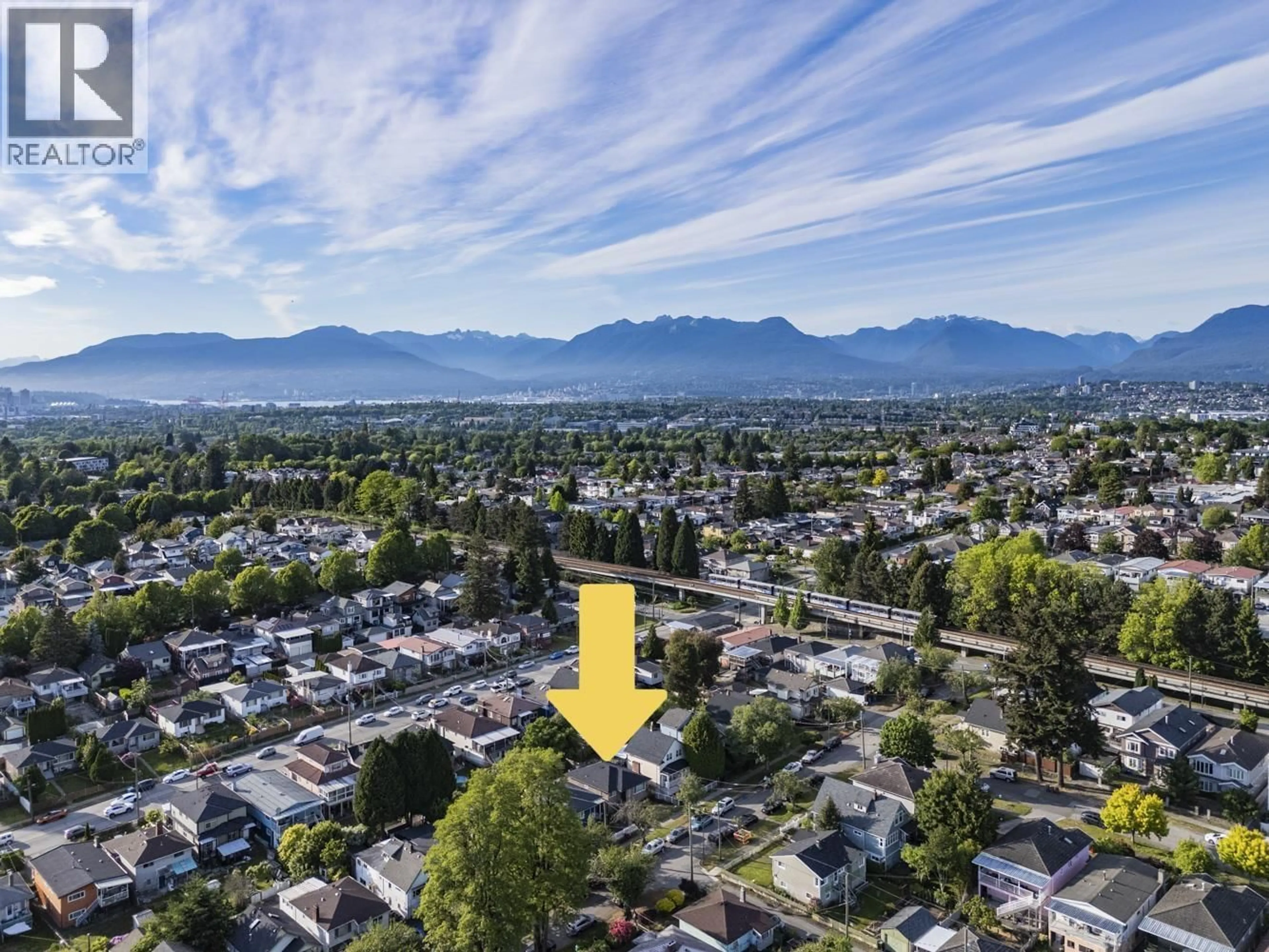 A pic from outside/outdoor area/front of a property/back of a property/a pic from drone, mountain view for 1 - 4967 SPENCER STREET, Vancouver British Columbia V5R3Z9