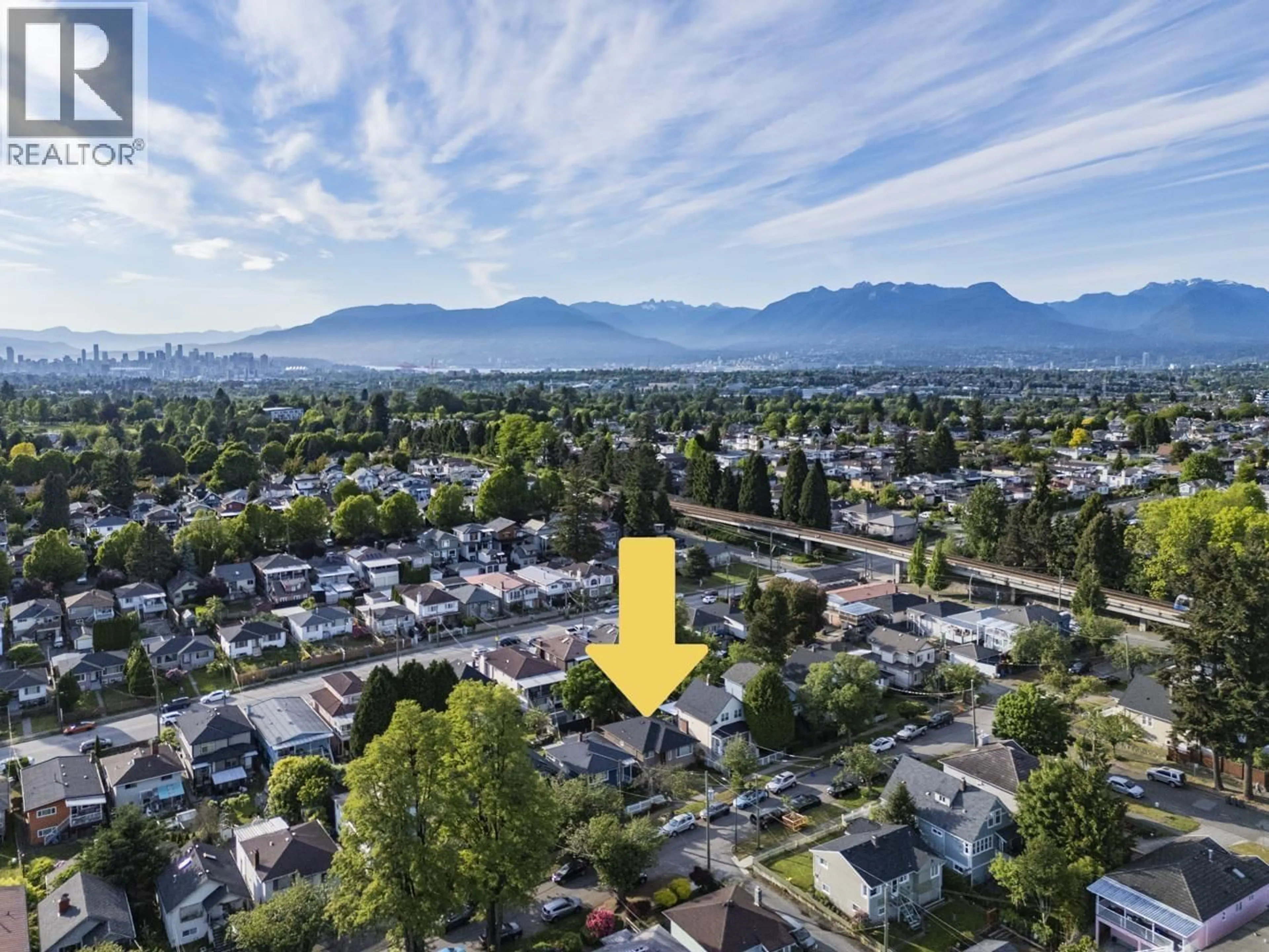 A pic from outside/outdoor area/front of a property/back of a property/a pic from drone, mountain view for 1 - 4967 SPENCER STREET, Vancouver British Columbia V5R3Z9