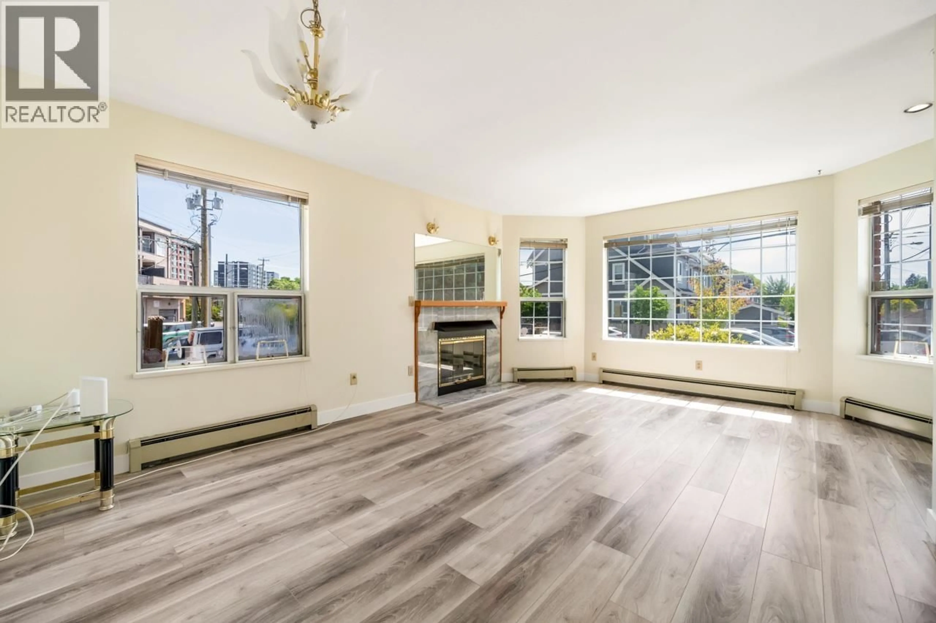 Living room with furniture, wood/laminate floor for 2547 34TH AVENUE, Vancouver British Columbia V5R2T1