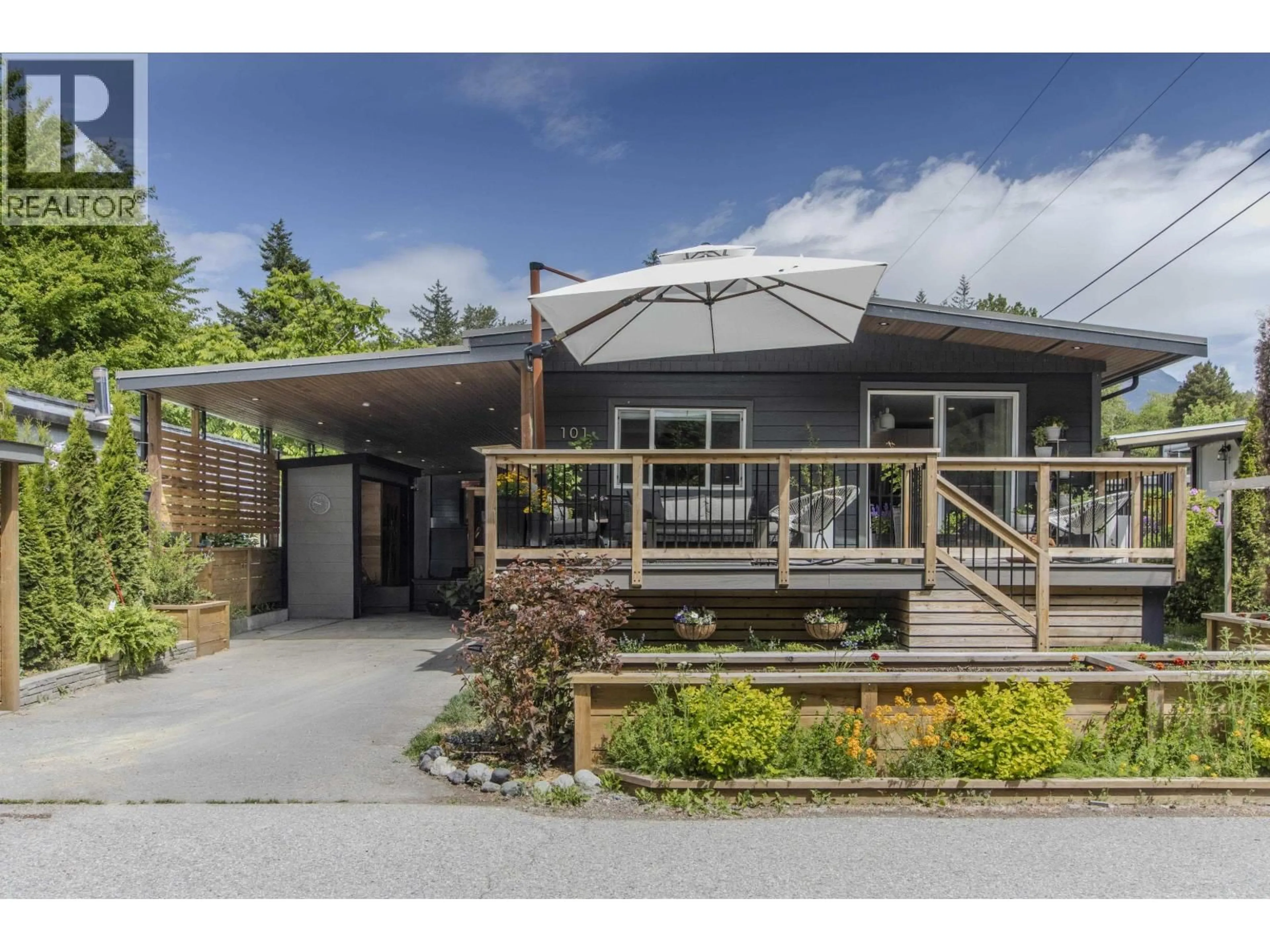 A pic from outside/outdoor area/front of a property/back of a property/a pic from drone, street for 101 - 40157 GOVERNMENT ROAD, Squamish British Columbia V8B0B3