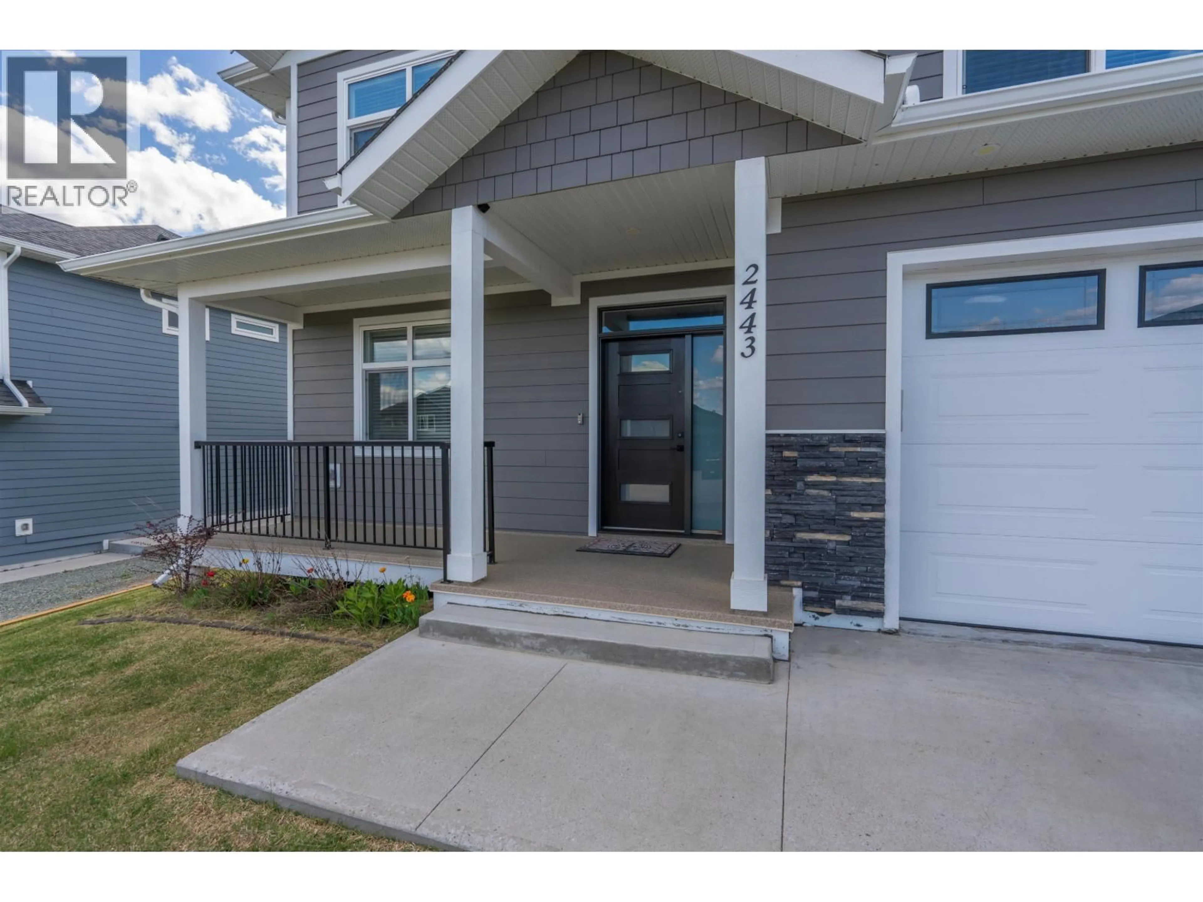 Home with vinyl exterior material, street for 2443 ROWE STREET, Prince George British Columbia V2N0B9