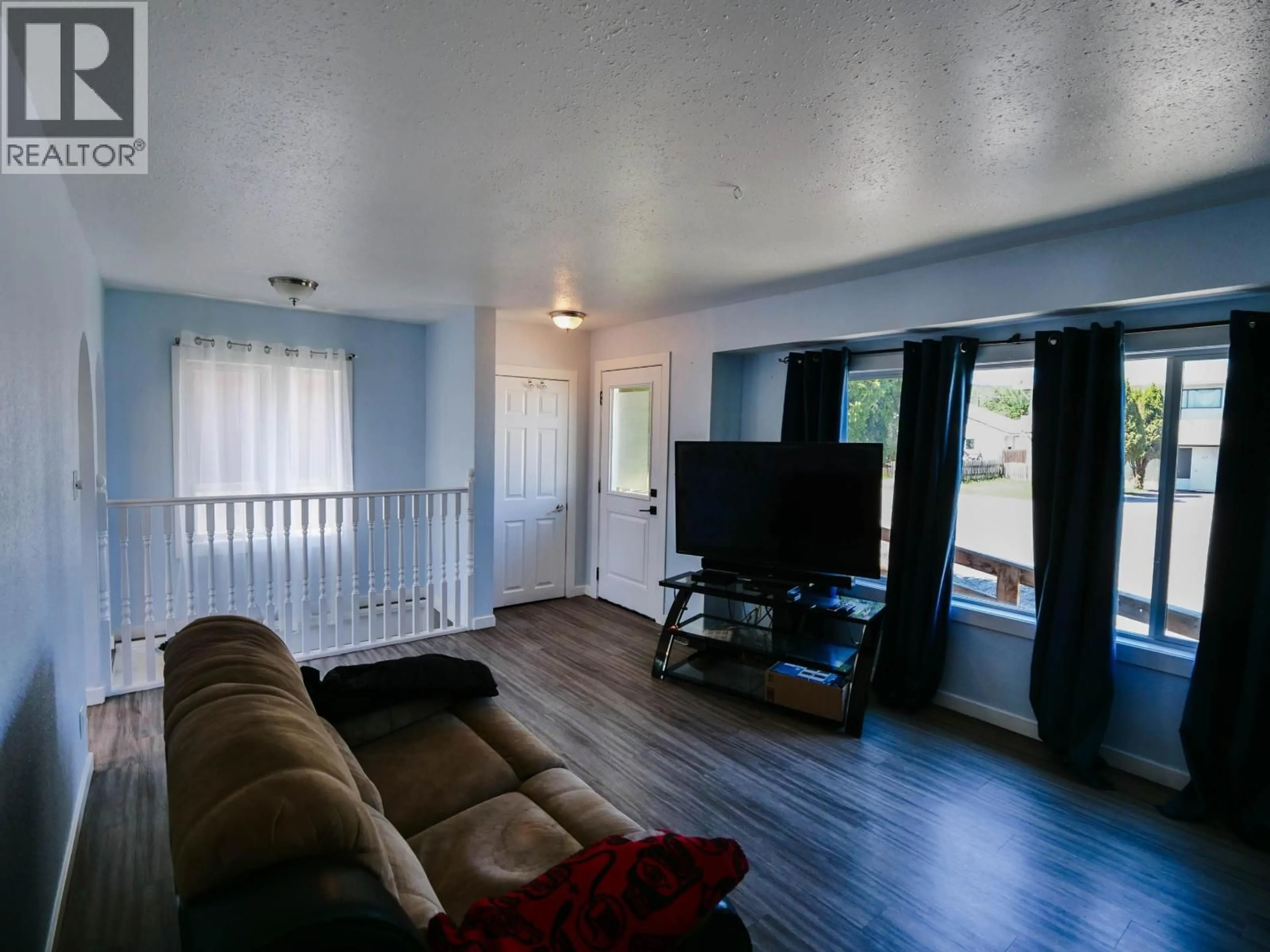 Living room with furniture, wood/laminate floor for 366 WINDER STREET, Quesnel British Columbia V2J1C6