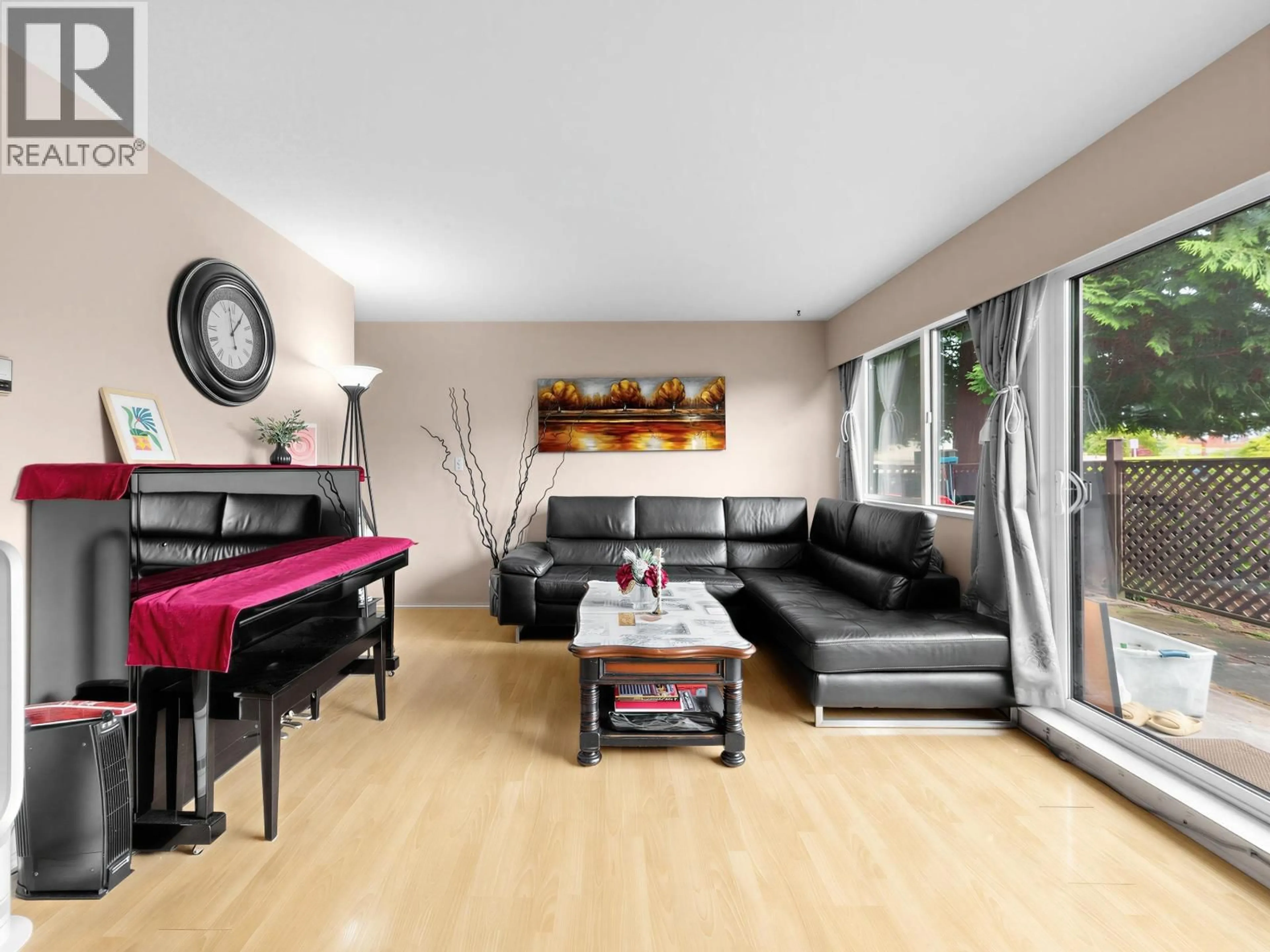 Living room with furniture, wood/laminate floor for 102 - 8020 RYAN ROAD, Richmond British Columbia V7A2E5