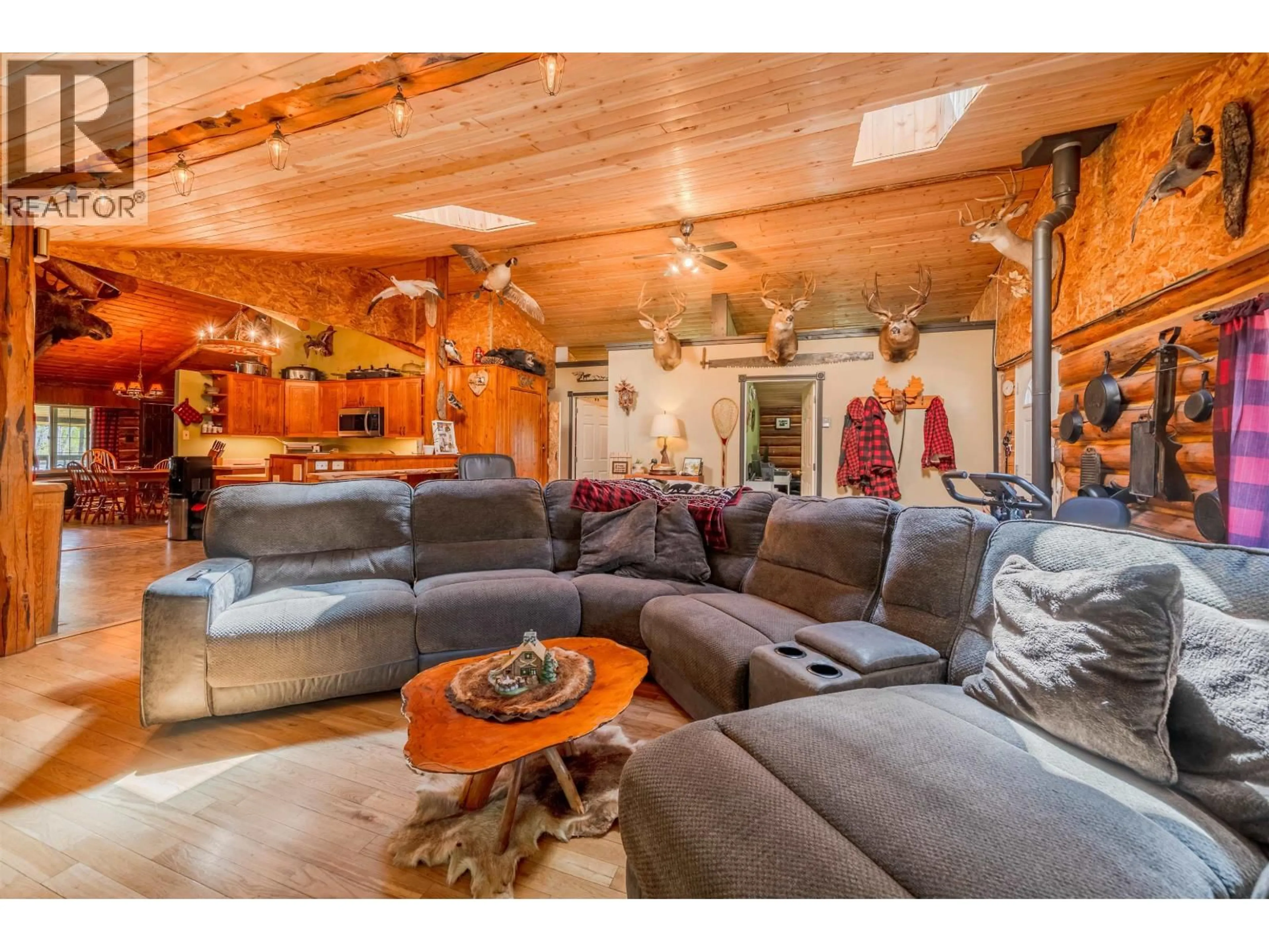 Living room with furniture, wood/laminate floor for 5134 PERKINS ROAD, Forest Grove British Columbia V0K1G0