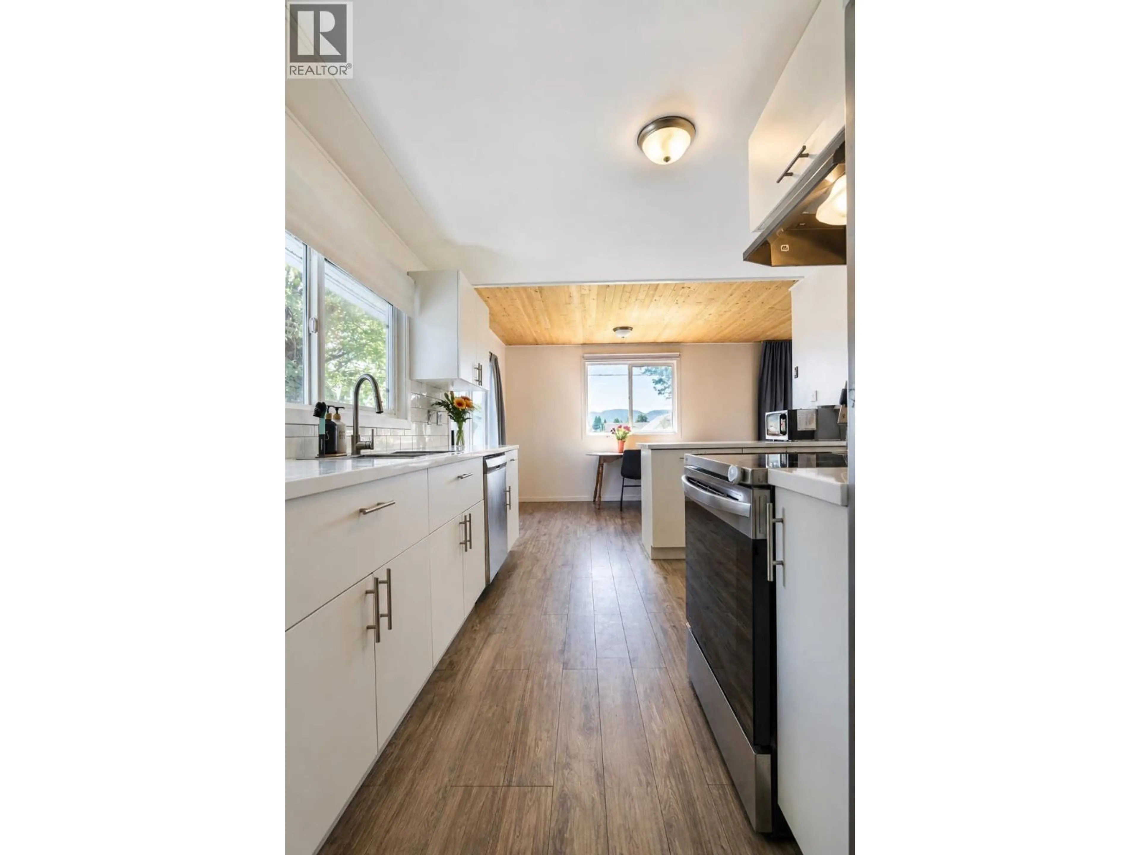 Open concept kitchen, wood/laminate floor for 87 SWANNELL STREET, Kitimat British Columbia V8C1H2