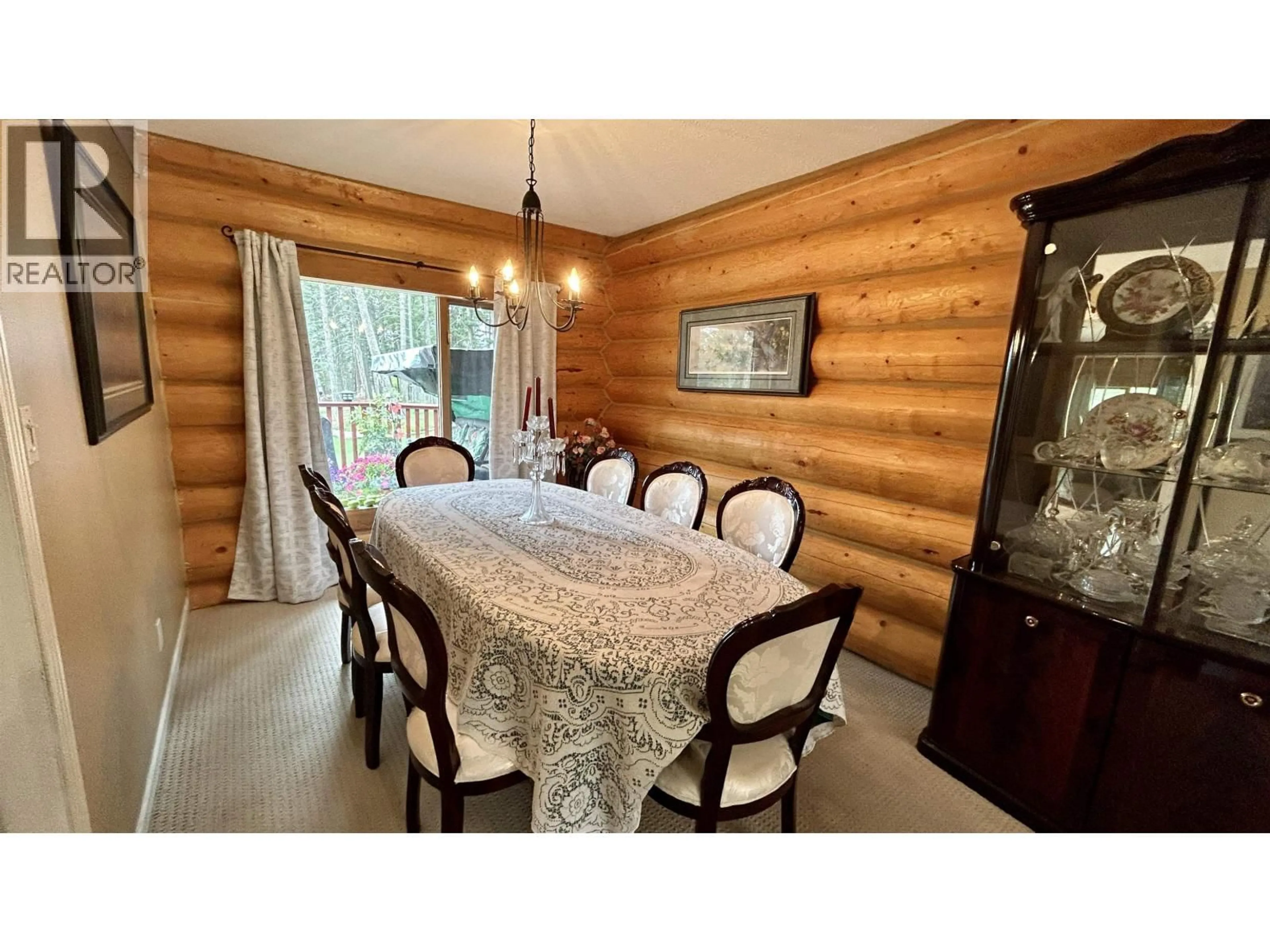 Dining room, wood/laminate floor for 4906 KITWANGA DRIVE, 108 Mile Ranch British Columbia V0K2Z0