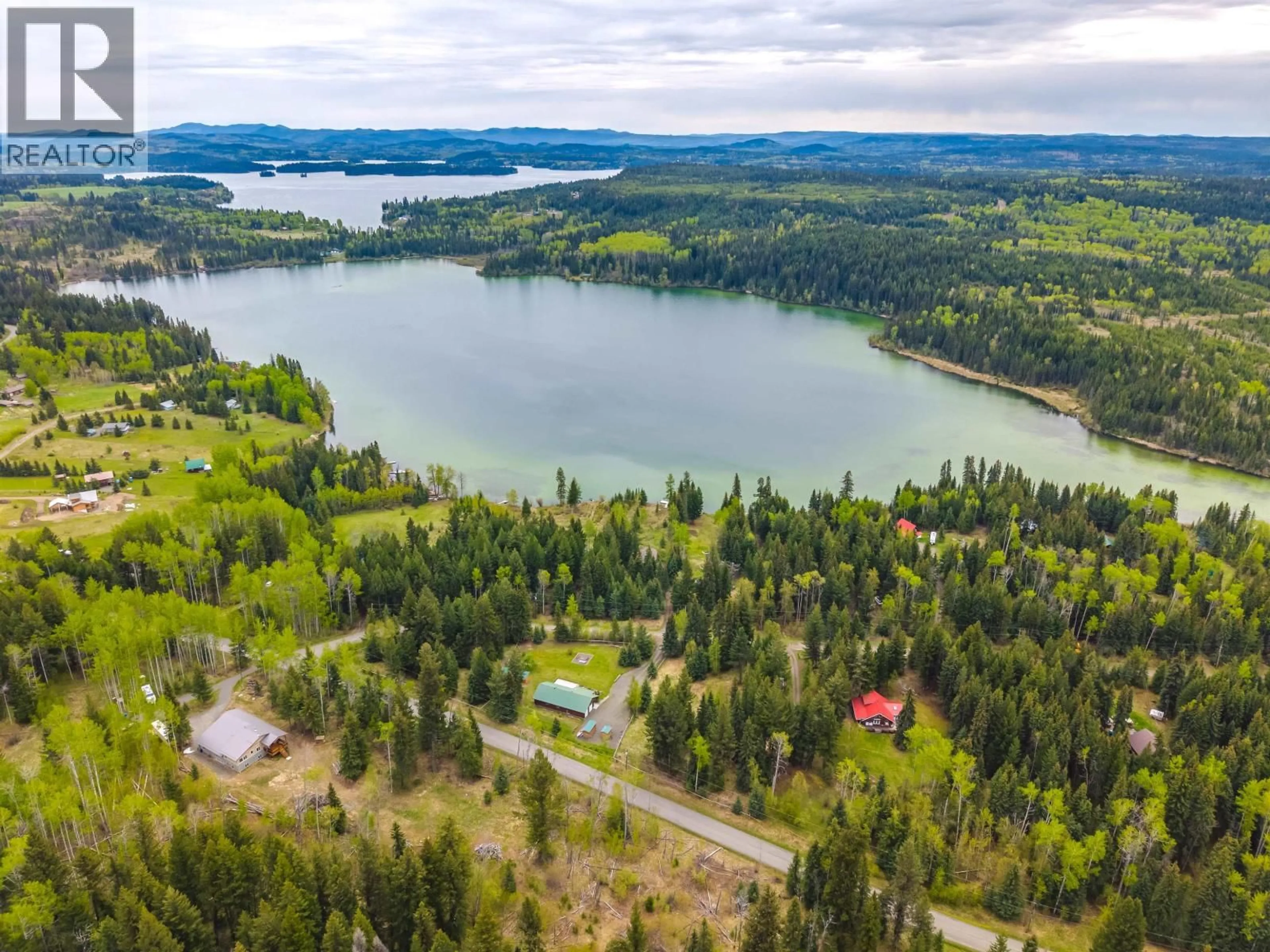 A pic from outside/outdoor area/front of a property/back of a property/a pic from drone, water/lake/river/ocean view for 7118 NOVETA ROAD, Bridge Lake British Columbia V0K1X2