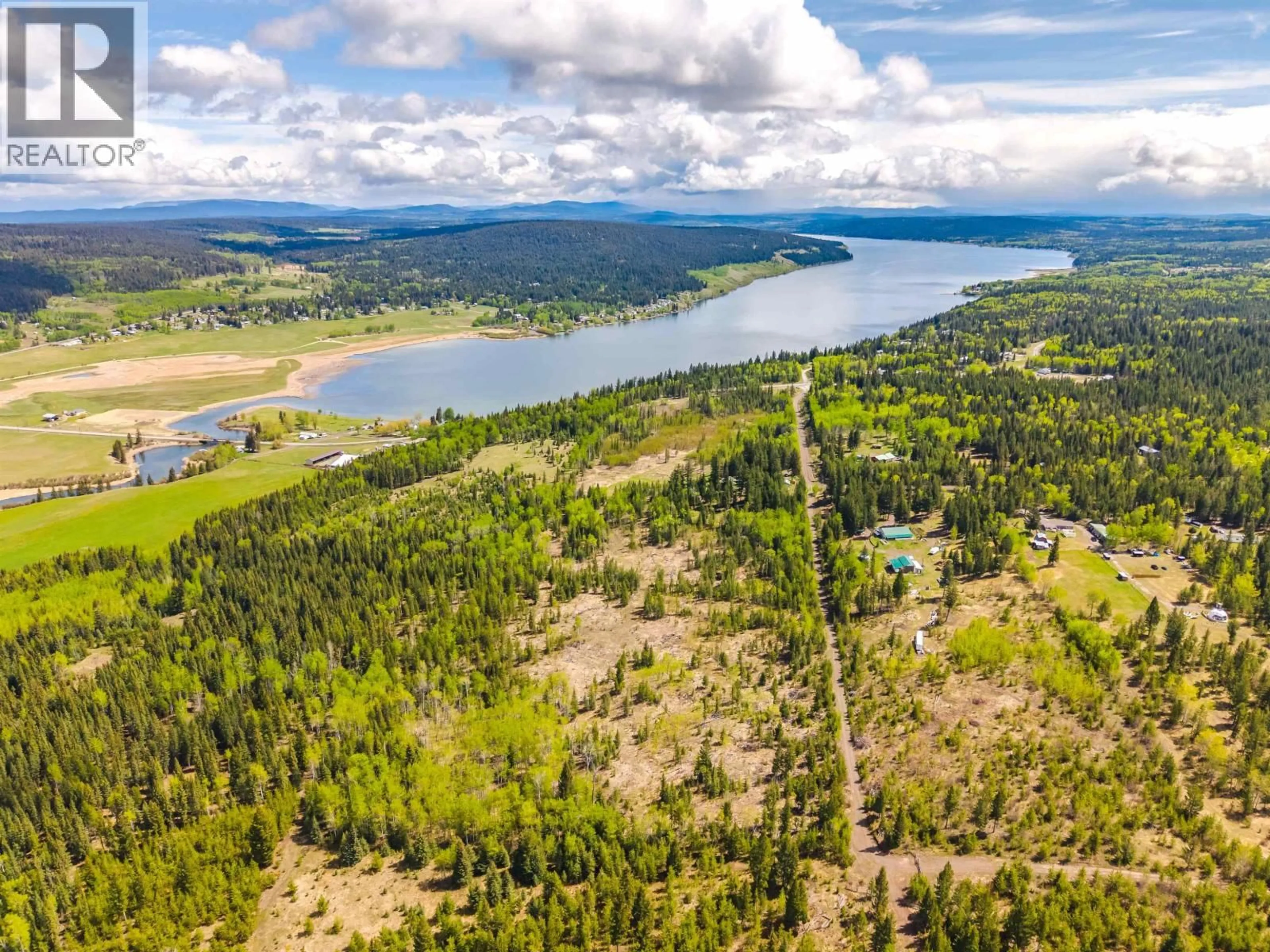 A pic from outside/outdoor area/front of a property/back of a property/a pic from drone, water/lake/river/ocean view for 6017 TOOMEY ROAD, 100 Mile House British Columbia V0K2E3