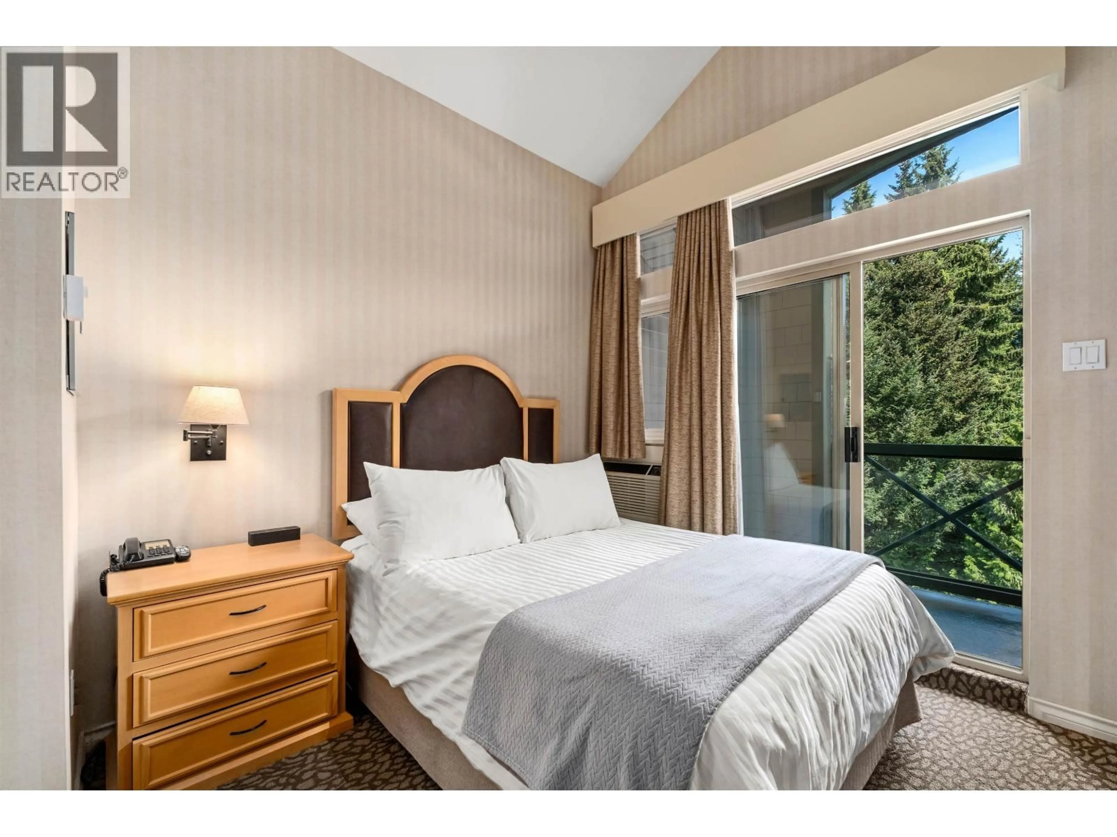 Bedroom with bed, wood/laminate floor for 409 - 4319 MAIN STREET, Whistler British Columbia V8E1B1