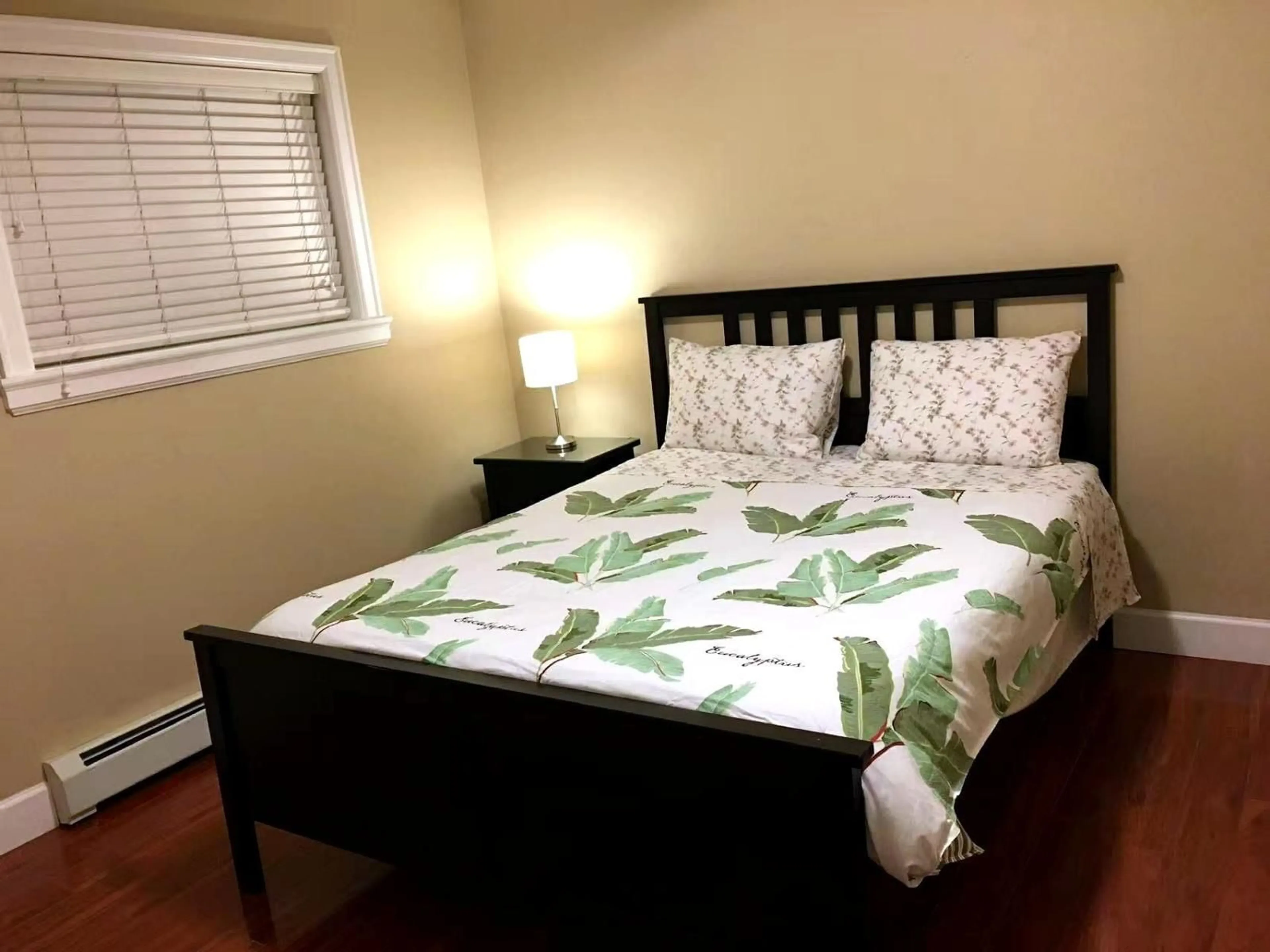 Bedroom with bed, wood/laminate floor for 14926 102A AVENUE, Surrey British Columbia V3R1K9